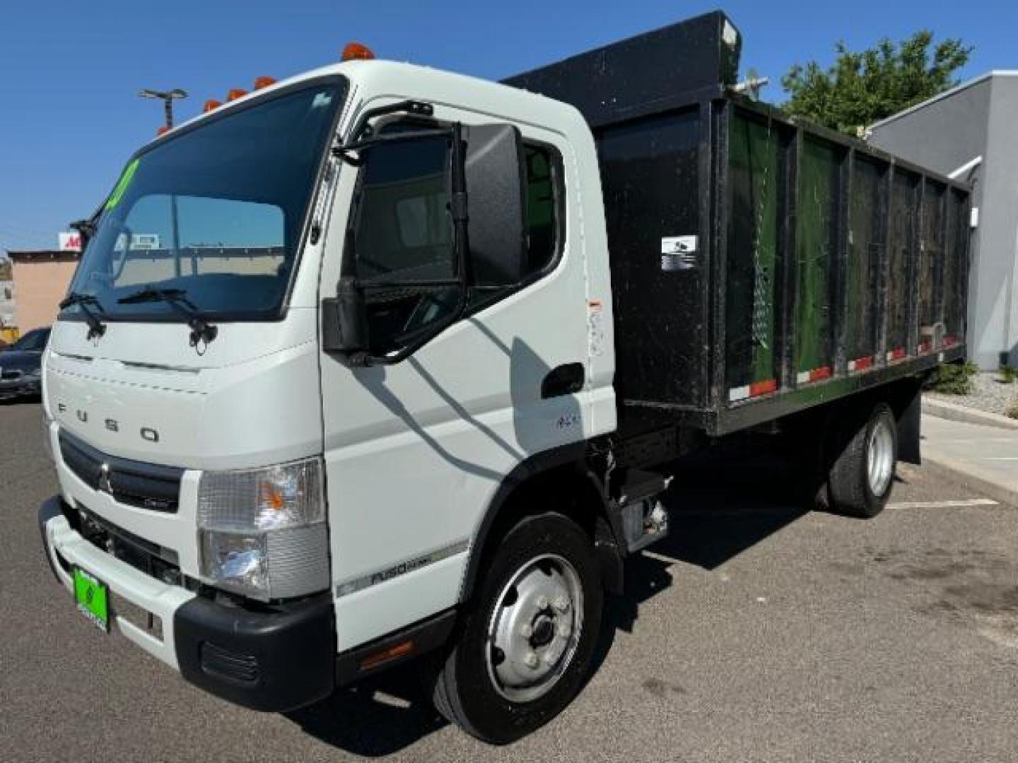 2020 White /Black Mitsubishi Fuso FE180 (4UZCXE119LG) with an 6L engine, Automatic transmission, located at 1865 East Red Hills Pkwy, St. George, 84770, (435) 628-0023, 37.120850, -113.543640 - Fuso FE180 dump truck. 26k miles. Runs a drives great! FE180 Dump Truck is a powerful and versatile commercial vehicle with a GVWR of 17,995 pounds. It is powered by the GMC 6.0L turbocharged V8 gas engine paired with an Allison 6-speed automatic transmission. Standard features include air conditi - Photo#2