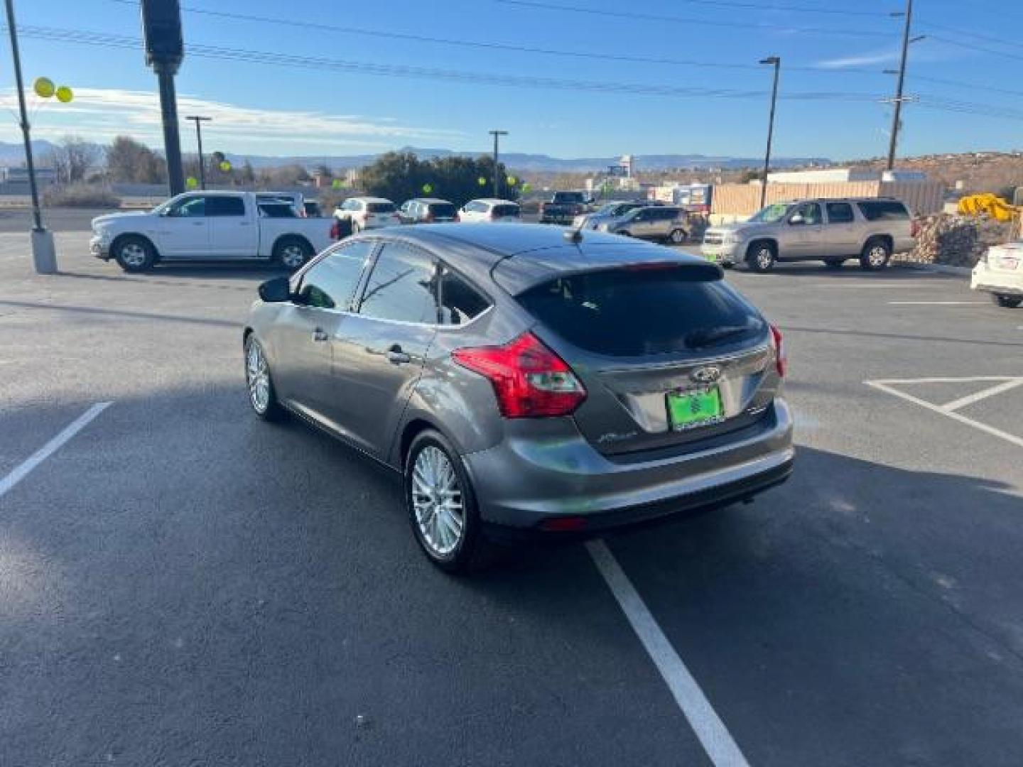2013 Gray /Charcoal Black Ford Focus Titanium Hatch (1FADP3N23DL) with an 2.0L L4 DOHC 16V engine, 6-Speed Automatic transmission, located at 940 North Main Street, Cedar City, UT, 84720, (435) 628-0023, 37.692936, -113.061897 - We specialize in helping ALL people get the best financing available. No matter your credit score, good, bad or none we can get you an amazing rate. Had a bankruptcy, divorce, or repossessions? We give you the green light to get your credit back on the road. Low down and affordable payments that fit - Photo#4