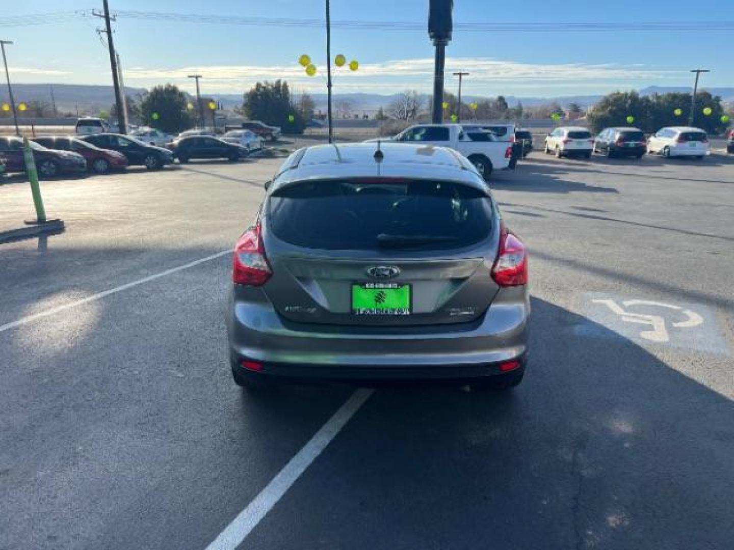 2013 Gray /Charcoal Black Ford Focus Titanium Hatch (1FADP3N23DL) with an 2.0L L4 DOHC 16V engine, 6-Speed Automatic transmission, located at 940 North Main Street, Cedar City, UT, 84720, (435) 628-0023, 37.692936, -113.061897 - We specialize in helping ALL people get the best financing available. No matter your credit score, good, bad or none we can get you an amazing rate. Had a bankruptcy, divorce, or repossessions? We give you the green light to get your credit back on the road. Low down and affordable payments that fit - Photo#5
