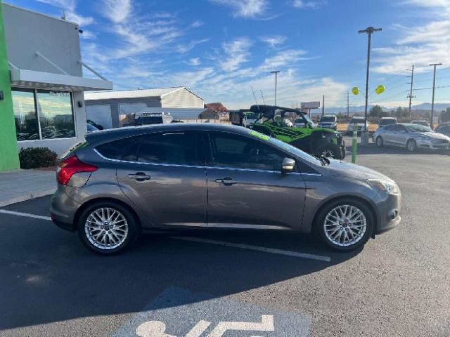 2013 Gray /Charcoal Black Ford Focus Titanium Hatch (1FADP3N23DL) with an 2.0L L4 DOHC 16V engine, 6-Speed Automatic transmission, located at 940 North Main Street, Cedar City, UT, 84720, (435) 628-0023, 37.692936, -113.061897 - We specialize in helping ALL people get the best financing available. No matter your credit score, good, bad or none we can get you an amazing rate. Had a bankruptcy, divorce, or repossessions? We give you the green light to get your credit back on the road. Low down and affordable payments that fit - Photo#7