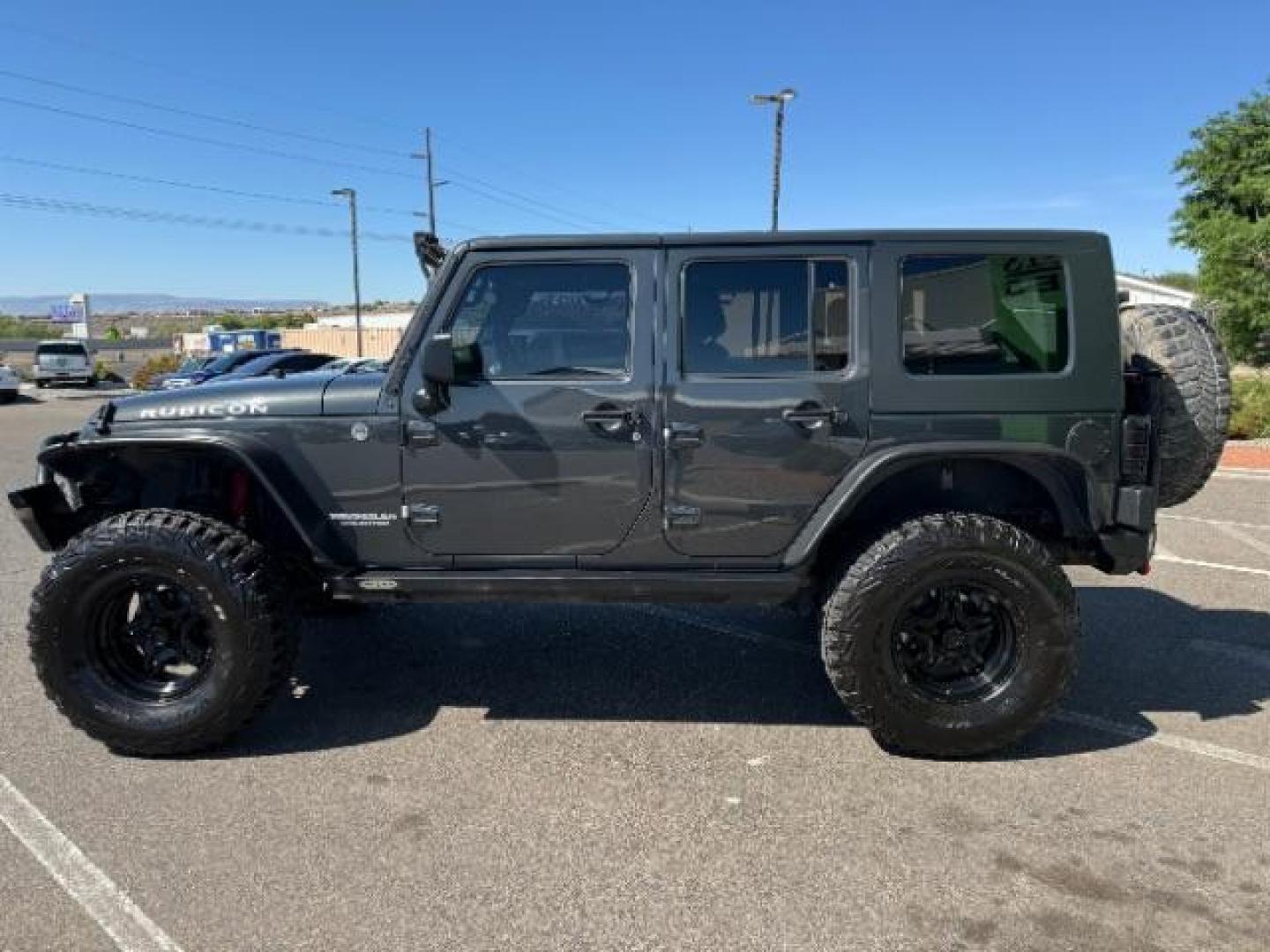 2010 Dark Charcoal Pearl with Black Hard Top /Dark Slate Gray/Medium Slate Gray Cloth Interior Jeep Wrangler Unlimited Rubicon 4WD (1J4BA6H12AL) with an 3.8L V6 OHV 12V engine, 4-Speed Automatic transmission, located at 1865 East Red Hills Pkwy, St. George, 84770, (435) 628-0023, 37.120850, -113.543640 - Photo#3
