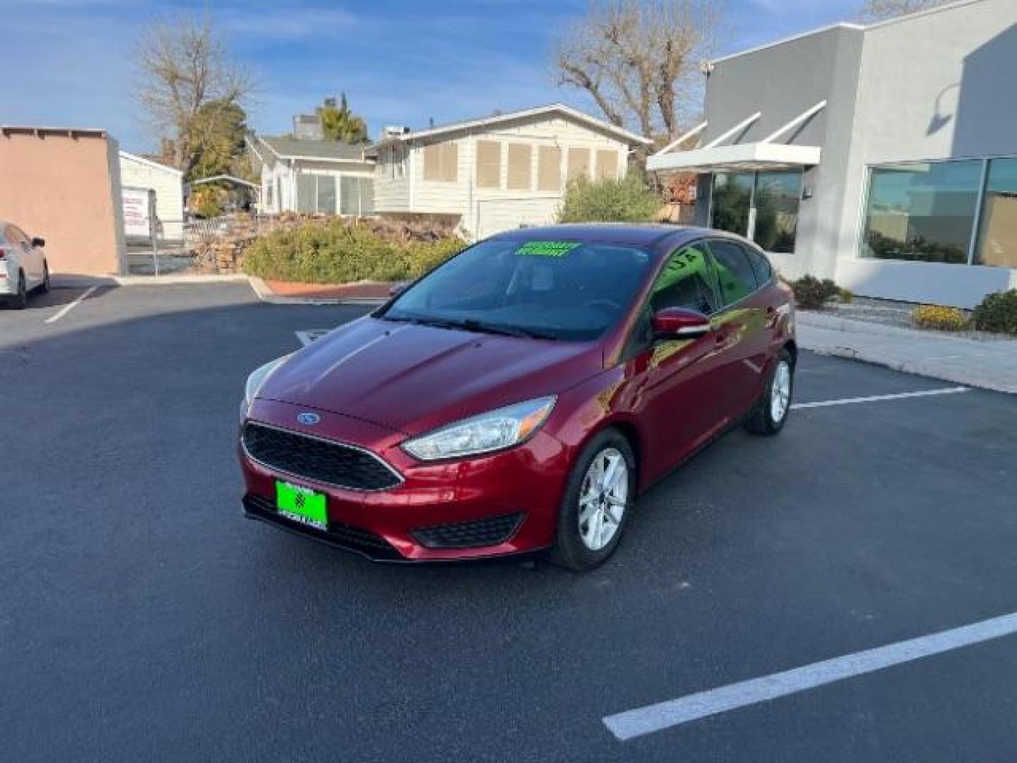 2015 Ruby Red Metallic Tinted Clearcoat /Charcoal Black Insert w/Warm Steel Surround, cloth Ford Focus SE Hatch (1FADP3K21FL) with an 2.0L L4 DOHC 16V engine, 4-Speed Automatic transmission, located at 1865 East Red Hills Pkwy, St. George, 84770, (435) 628-0023, 37.120850, -113.543640 - We specialize in helping ALL people get the best financing available. No matter your credit score, good, bad or none we can get you an amazing rate. Had a bankruptcy, divorce, or repossessions? We give you the green light to get your credit back on the road. Low down and affordable payments that fit - Photo#2
