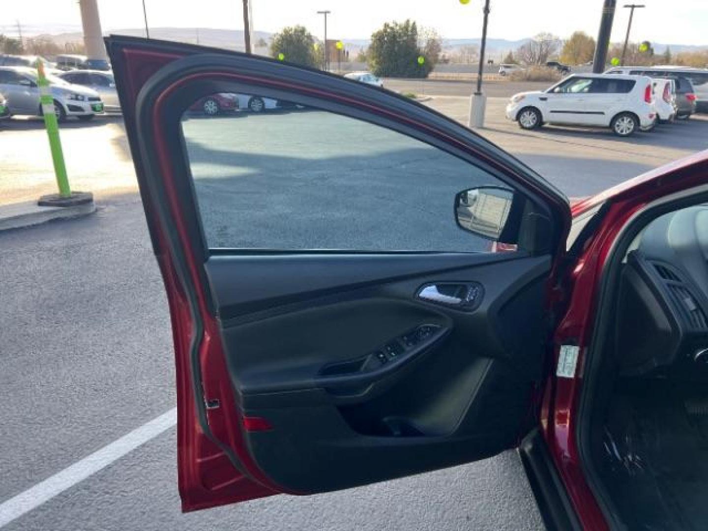 2015 Ruby Red Metallic Tinted Clearcoat /Charcoal Black Insert w/Warm Steel Surround, cloth Ford Focus SE Hatch (1FADP3K21FL) with an 2.0L L4 DOHC 16V engine, 4-Speed Automatic transmission, located at 1865 East Red Hills Pkwy, St. George, 84770, (435) 628-0023, 37.120850, -113.543640 - We specialize in helping ALL people get the best financing available. No matter your credit score, good, bad or none we can get you an amazing rate. Had a bankruptcy, divorce, or repossessions? We give you the green light to get your credit back on the road. Low down and affordable payments that fit - Photo#12