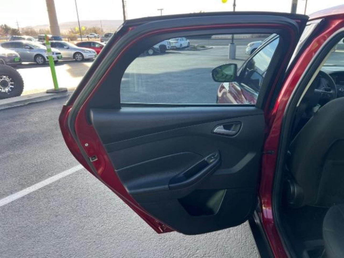 2015 Ruby Red Metallic Tinted Clearcoat /Charcoal Black Insert w/Warm Steel Surround, cloth Ford Focus SE Hatch (1FADP3K21FL) with an 2.0L L4 DOHC 16V engine, 4-Speed Automatic transmission, located at 1865 East Red Hills Pkwy, St. George, 84770, (435) 628-0023, 37.120850, -113.543640 - We specialize in helping ALL people get the best financing available. No matter your credit score, good, bad or none we can get you an amazing rate. Had a bankruptcy, divorce, or repossessions? We give you the green light to get your credit back on the road. Low down and affordable payments that fit - Photo#21