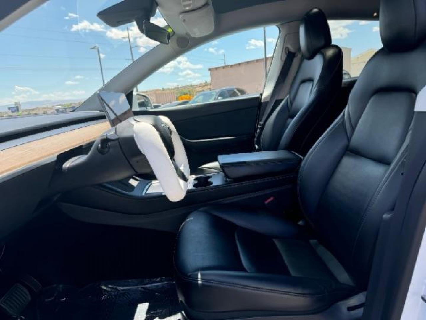 2022 Pearl White Multi-Coat /All Black Tesla Model Y Long Range (7SAYGDEE0NF) with an ELECTRIC engine, 1-Speed Automatic transmission, located at 1865 East Red Hills Pkwy, St. George, 84770, (435) 628-0023, 37.120850, -113.543640 - SOLD - But we can find you any Tesla, Call us! ***Purchase price AFTER $4k rebate has been transferred to dealership*** This allows us to reduce the asking price from $28,995 (without tax rebate) to be under the $25k threshold. Visit Energy.gov for full rules. Beautiful LONG RANGE ALL WHEEL DRI - Photo#18