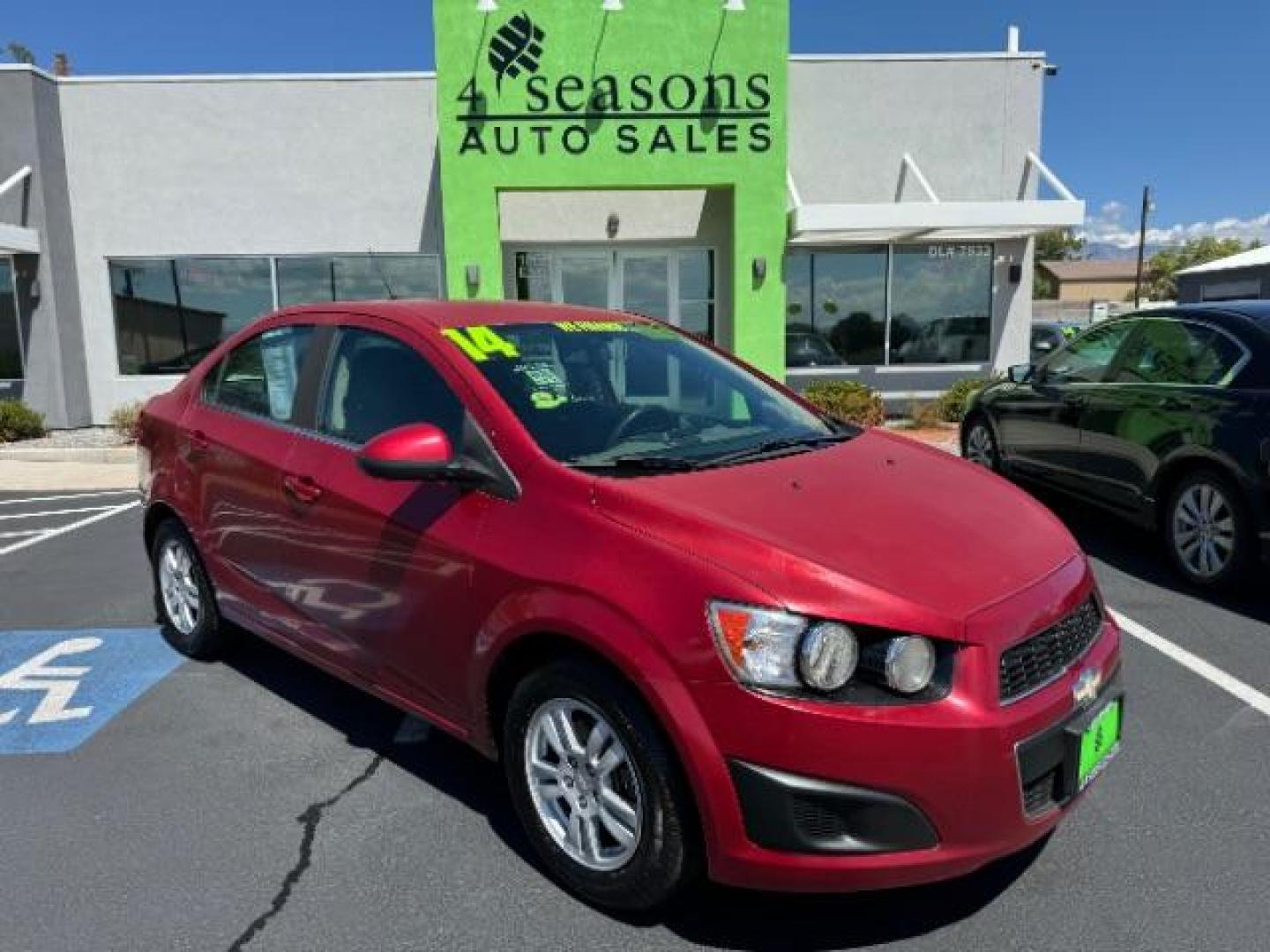 2014 Crystal Red Tintcoat /Jet Black/Dark Titanium Chevrolet Sonic LT Auto Sedan (1G1JC5SH5E4) with an 1.8L L4 DOHC 24V engine, 6-Speed Automatic transmission, located at 1865 East Red Hills Pkwy, St. George, 84770, (435) 628-0023, 37.120850, -113.543640 - We specialize in helping ALL people get the best financing available. No matter your credit score, good, bad or none we can get you an amazing rate. Had a bankruptcy, divorce, or repossessions? We give you the green light to get your credit back on the road. Low down and affordable payments that fit - Photo#0