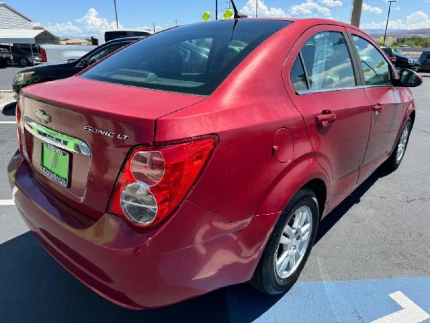 2014 Crystal Red Tintcoat /Jet Black/Dark Titanium Chevrolet Sonic LT Auto Sedan (1G1JC5SH5E4) with an 1.8L L4 DOHC 24V engine, 6-Speed Automatic transmission, located at 1865 East Red Hills Pkwy, St. George, 84770, (435) 628-0023, 37.120850, -113.543640 - We specialize in helping ALL people get the best financing available. No matter your credit score, good, bad or none we can get you an amazing rate. Had a bankruptcy, divorce, or repossessions? We give you the green light to get your credit back on the road. Low down and affordable payments that fit - Photo#6