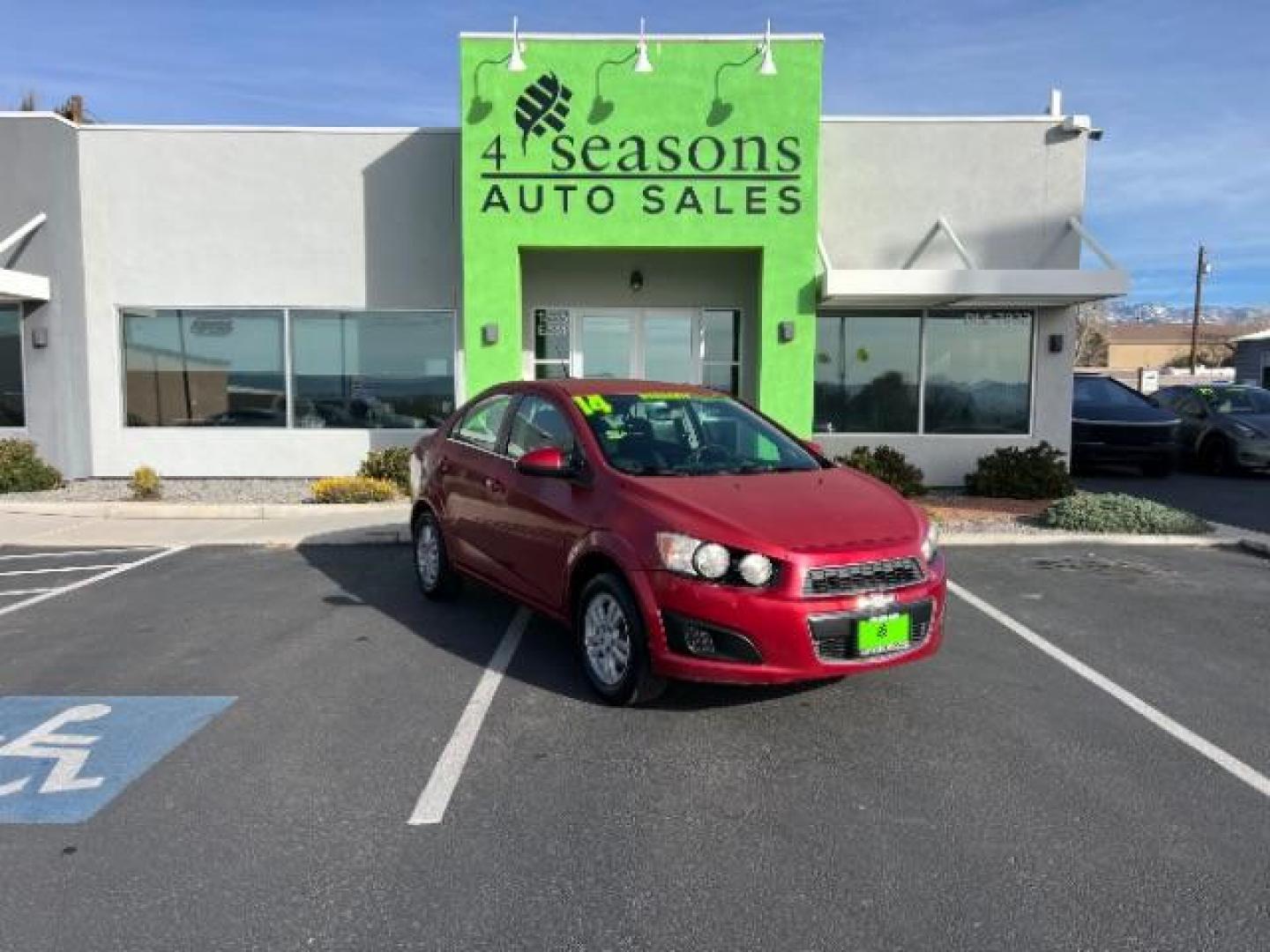 2014 Crystal Red Tintcoat /Jet Black/Brick Chevrolet Sonic LT Auto Sedan (1G1JC5SH5E4) with an 1.8L L4 DOHC 24V engine, 6-Speed Automatic transmission, located at 1865 East Red Hills Pkwy, St. George, 84770, (435) 628-0023, 37.120850, -113.543640 - We specialize in helping ALL people get the best financing available. No matter your credit score, good, bad or none we can get you an amazing rate. Had a bankruptcy, divorce, or repossessions? We give you the green light to get your credit back on the road. Low down and affordable payments that fit - Photo#0
