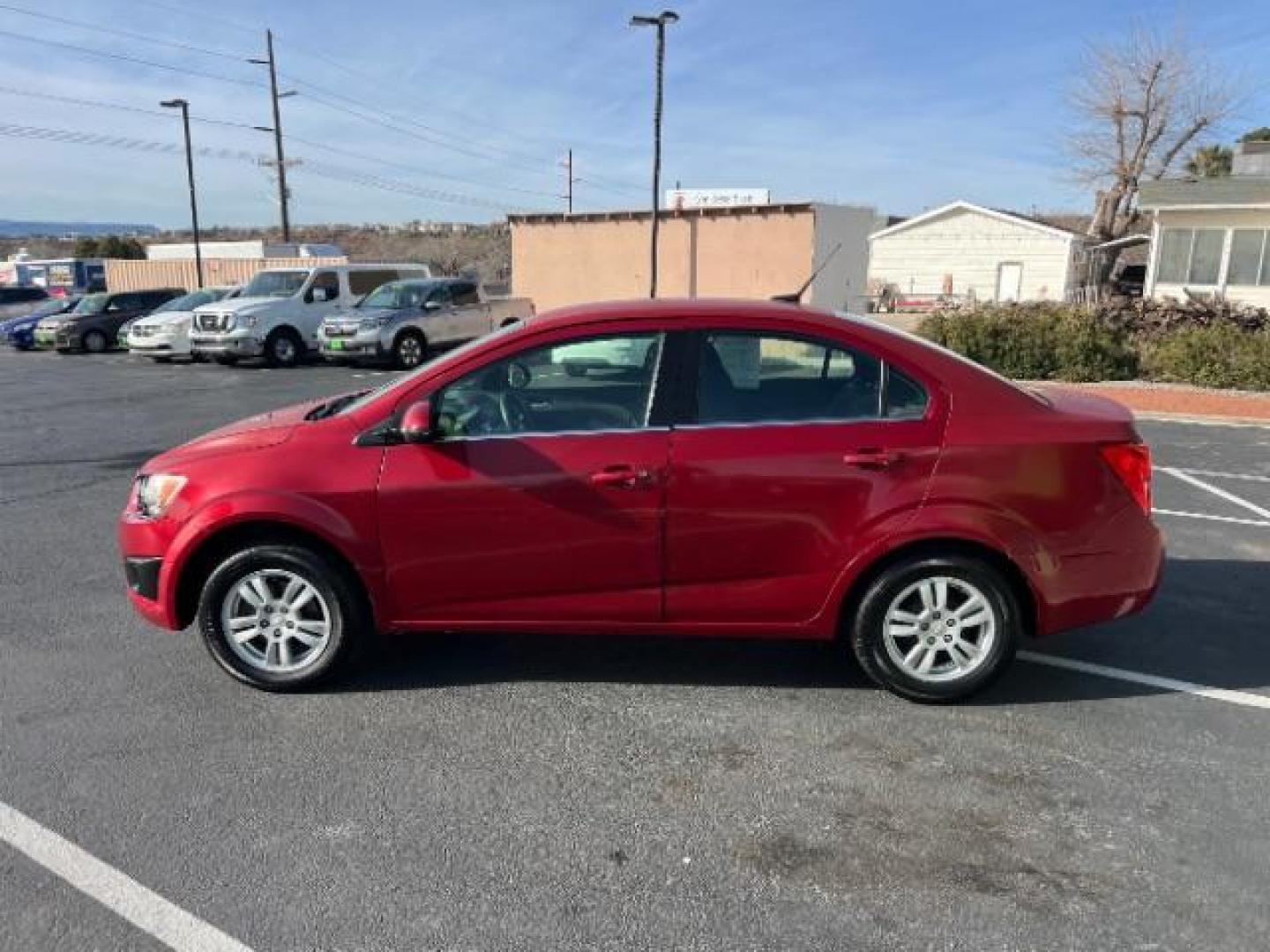 2014 Crystal Red Tintcoat /Jet Black/Brick Chevrolet Sonic LT Auto Sedan (1G1JC5SH5E4) with an 1.8L L4 DOHC 24V engine, 6-Speed Automatic transmission, located at 1865 East Red Hills Pkwy, St. George, 84770, (435) 628-0023, 37.120850, -113.543640 - We specialize in helping ALL people get the best financing available. No matter your credit score, good, bad or none we can get you an amazing rate. Had a bankruptcy, divorce, or repossessions? We give you the green light to get your credit back on the road. Low down and affordable payments that fit - Photo#3