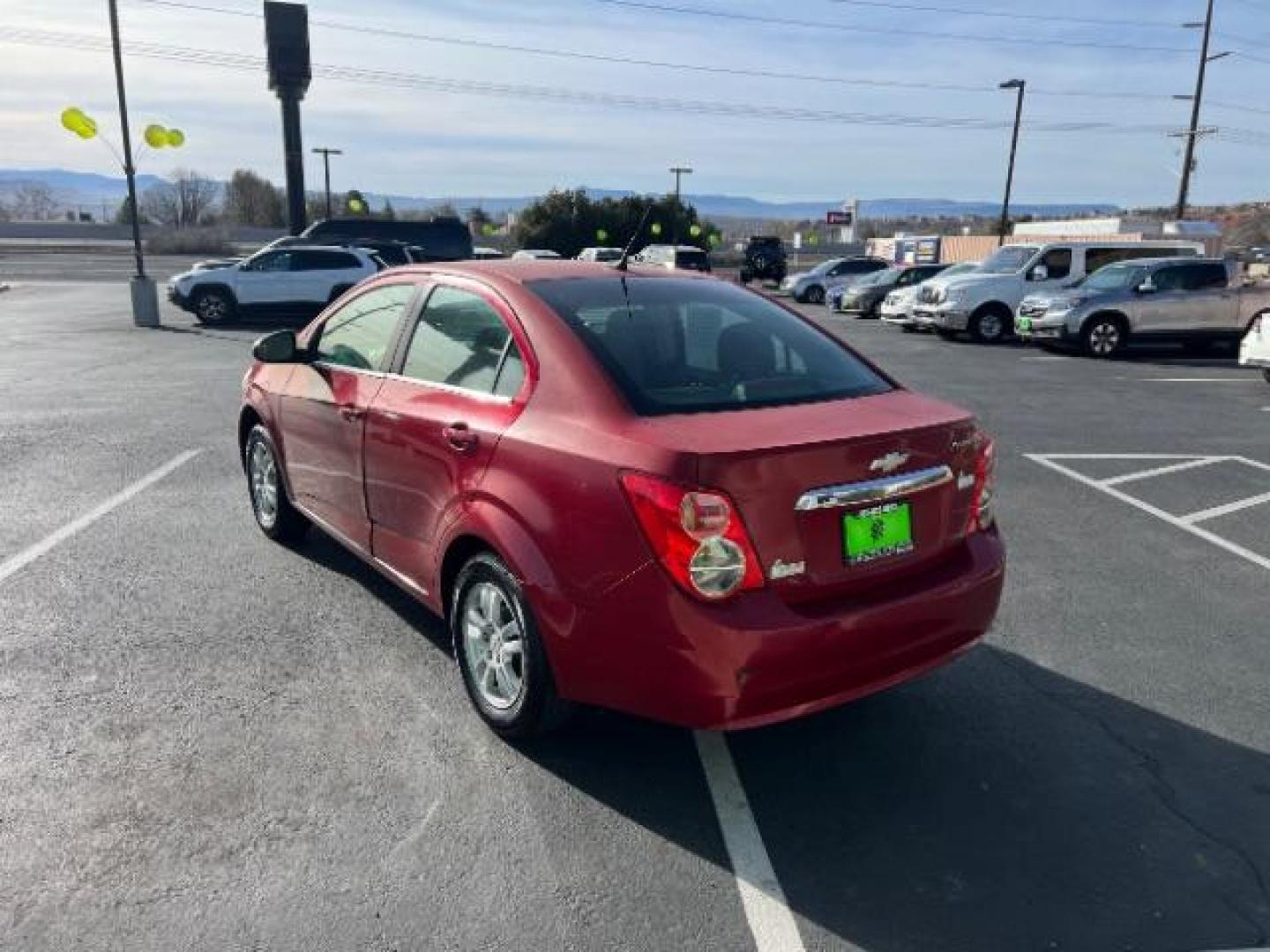 2014 Crystal Red Tintcoat /Jet Black/Brick Chevrolet Sonic LT Auto Sedan (1G1JC5SH5E4) with an 1.8L L4 DOHC 24V engine, 6-Speed Automatic transmission, located at 1865 East Red Hills Pkwy, St. George, 84770, (435) 628-0023, 37.120850, -113.543640 - We specialize in helping ALL people get the best financing available. No matter your credit score, good, bad or none we can get you an amazing rate. Had a bankruptcy, divorce, or repossessions? We give you the green light to get your credit back on the road. Low down and affordable payments that fit - Photo#4