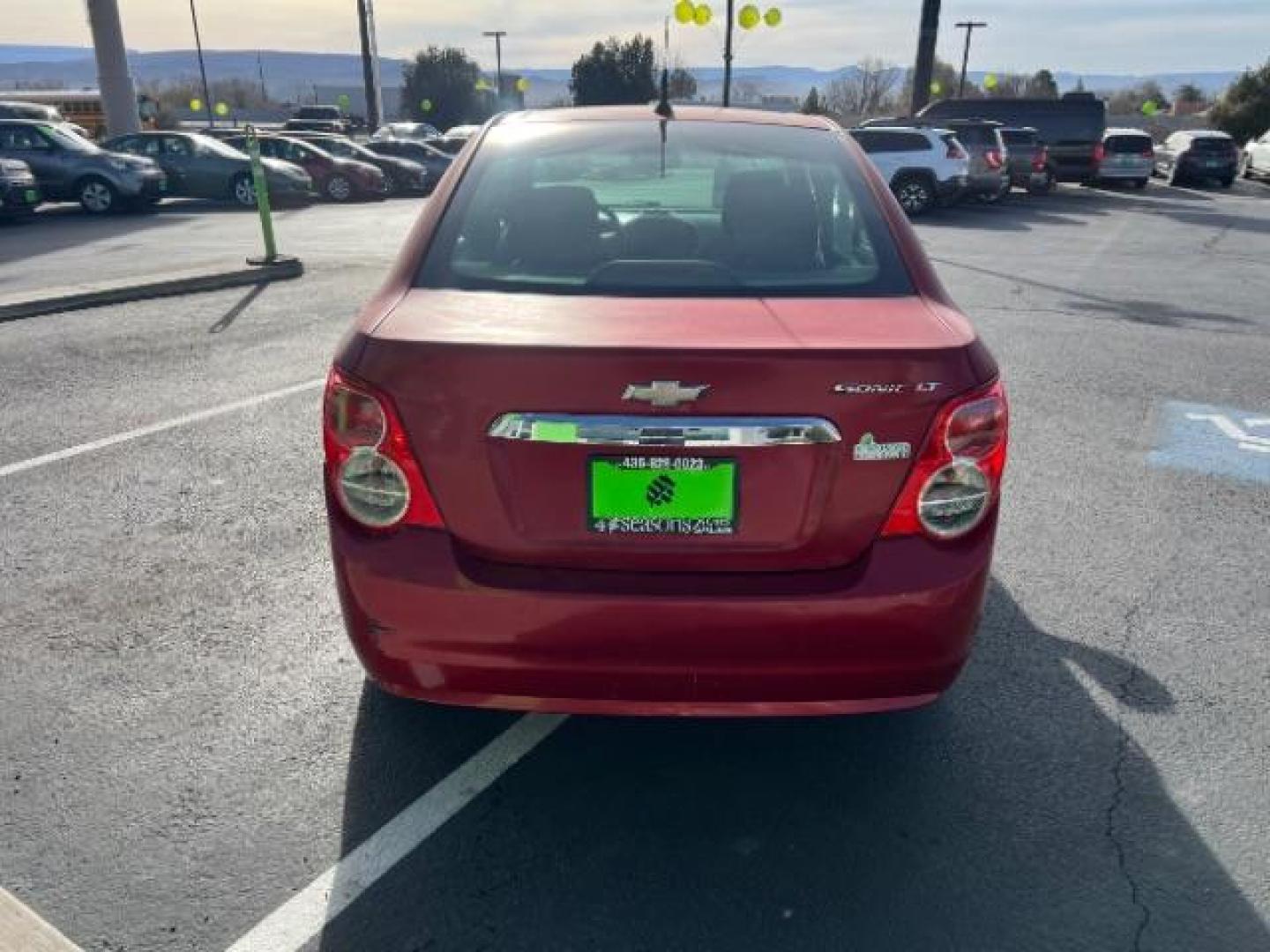 2014 Crystal Red Tintcoat /Jet Black/Brick Chevrolet Sonic LT Auto Sedan (1G1JC5SH5E4) with an 1.8L L4 DOHC 24V engine, 6-Speed Automatic transmission, located at 1865 East Red Hills Pkwy, St. George, 84770, (435) 628-0023, 37.120850, -113.543640 - We specialize in helping ALL people get the best financing available. No matter your credit score, good, bad or none we can get you an amazing rate. Had a bankruptcy, divorce, or repossessions? We give you the green light to get your credit back on the road. Low down and affordable payments that fit - Photo#5