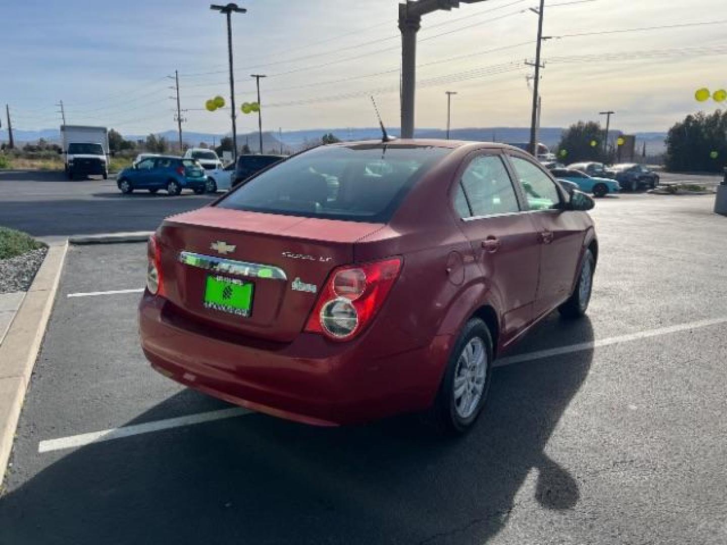 2014 Crystal Red Tintcoat /Jet Black/Brick Chevrolet Sonic LT Auto Sedan (1G1JC5SH5E4) with an 1.8L L4 DOHC 24V engine, 6-Speed Automatic transmission, located at 1865 East Red Hills Pkwy, St. George, 84770, (435) 628-0023, 37.120850, -113.543640 - We specialize in helping ALL people get the best financing available. No matter your credit score, good, bad or none we can get you an amazing rate. Had a bankruptcy, divorce, or repossessions? We give you the green light to get your credit back on the road. Low down and affordable payments that fit - Photo#6