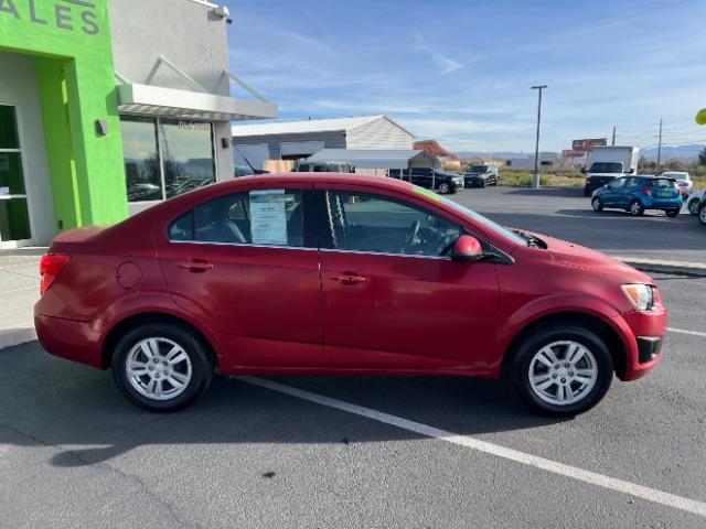 2014 Crystal Red Tintcoat /Jet Black/Brick Chevrolet Sonic LT Auto Sedan (1G1JC5SH5E4) with an 1.8L L4 DOHC 24V engine, 6-Speed Automatic transmission, located at 940 North Main Street, Cedar City, UT, 84720, (435) 628-0023, 37.692936, -113.061897 - We specialize in helping ALL people get the best financing available. No matter your credit score, good, bad or none we can get you an amazing rate. Had a bankruptcy, divorce, or repossessions? We give you the green light to get your credit back on the road. Low down and affordable payments that fit - Photo#7