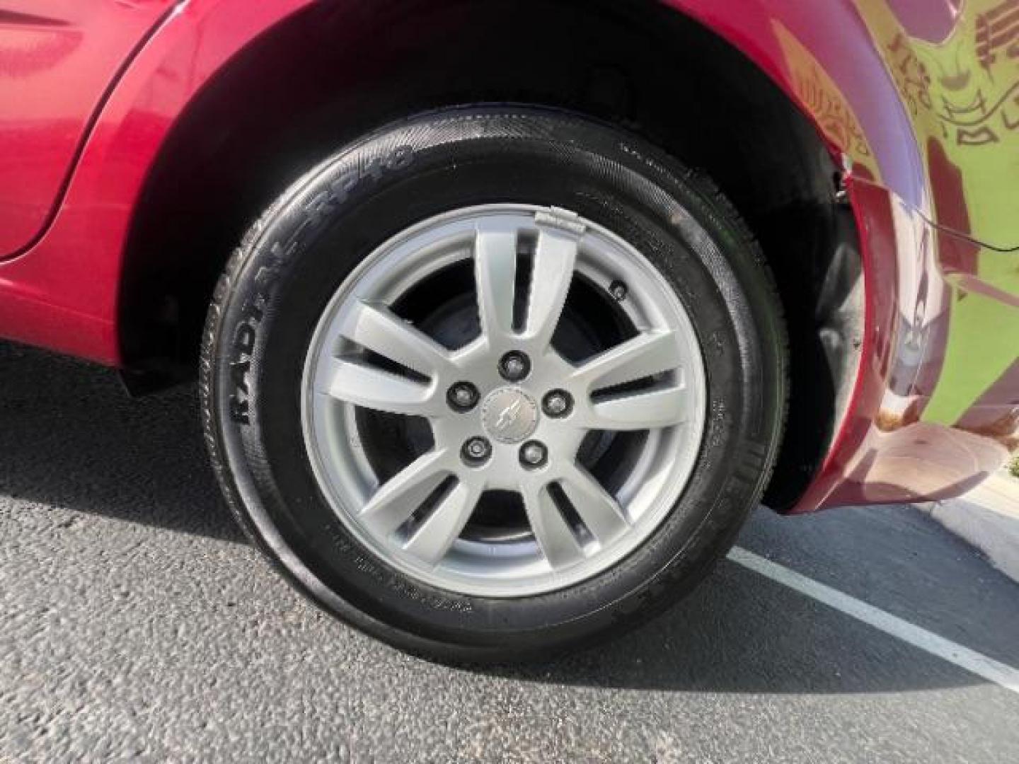 2014 Crystal Red Tintcoat /Jet Black/Brick Chevrolet Sonic LT Auto Sedan (1G1JC5SH5E4) with an 1.8L L4 DOHC 24V engine, 6-Speed Automatic transmission, located at 1865 East Red Hills Pkwy, St. George, 84770, (435) 628-0023, 37.120850, -113.543640 - We specialize in helping ALL people get the best financing available. No matter your credit score, good, bad or none we can get you an amazing rate. Had a bankruptcy, divorce, or repossessions? We give you the green light to get your credit back on the road. Low down and affordable payments that fit - Photo#8