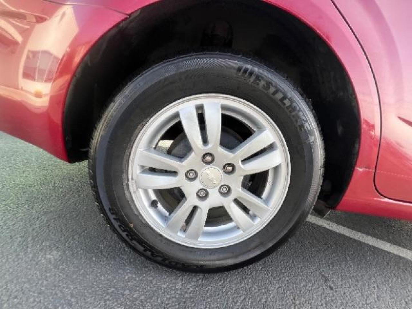 2014 Crystal Red Tintcoat /Jet Black/Brick Chevrolet Sonic LT Auto Sedan (1G1JC5SH5E4) with an 1.8L L4 DOHC 24V engine, 6-Speed Automatic transmission, located at 1865 East Red Hills Pkwy, St. George, 84770, (435) 628-0023, 37.120850, -113.543640 - We specialize in helping ALL people get the best financing available. No matter your credit score, good, bad or none we can get you an amazing rate. Had a bankruptcy, divorce, or repossessions? We give you the green light to get your credit back on the road. Low down and affordable payments that fit - Photo#9