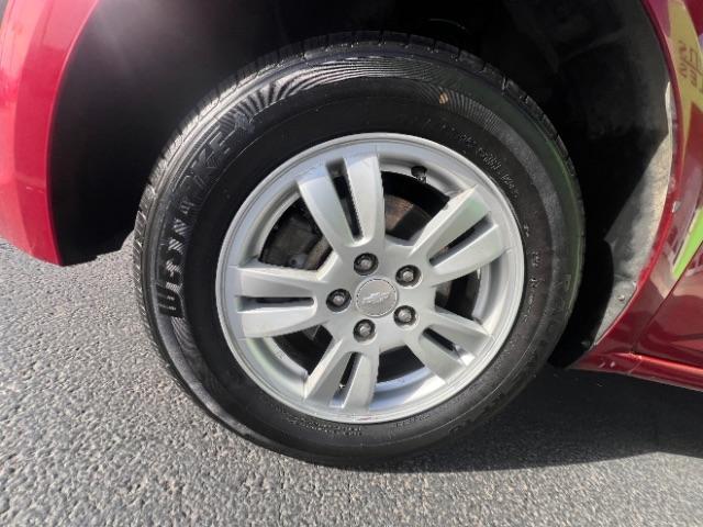 2014 Crystal Red Tintcoat /Jet Black/Brick Chevrolet Sonic LT Auto Sedan (1G1JC5SH5E4) with an 1.8L L4 DOHC 24V engine, 6-Speed Automatic transmission, located at 940 North Main Street, Cedar City, UT, 84720, (435) 628-0023, 37.692936, -113.061897 - We specialize in helping ALL people get the best financing available. No matter your credit score, good, bad or none we can get you an amazing rate. Had a bankruptcy, divorce, or repossessions? We give you the green light to get your credit back on the road. Low down and affordable payments that fit - Photo#11