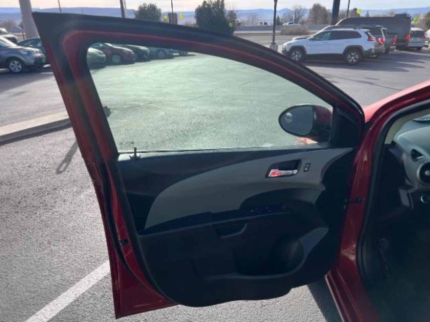2014 Crystal Red Tintcoat /Jet Black/Brick Chevrolet Sonic LT Auto Sedan (1G1JC5SH5E4) with an 1.8L L4 DOHC 24V engine, 6-Speed Automatic transmission, located at 1865 East Red Hills Pkwy, St. George, 84770, (435) 628-0023, 37.120850, -113.543640 - We specialize in helping ALL people get the best financing available. No matter your credit score, good, bad or none we can get you an amazing rate. Had a bankruptcy, divorce, or repossessions? We give you the green light to get your credit back on the road. Low down and affordable payments that fit - Photo#12
