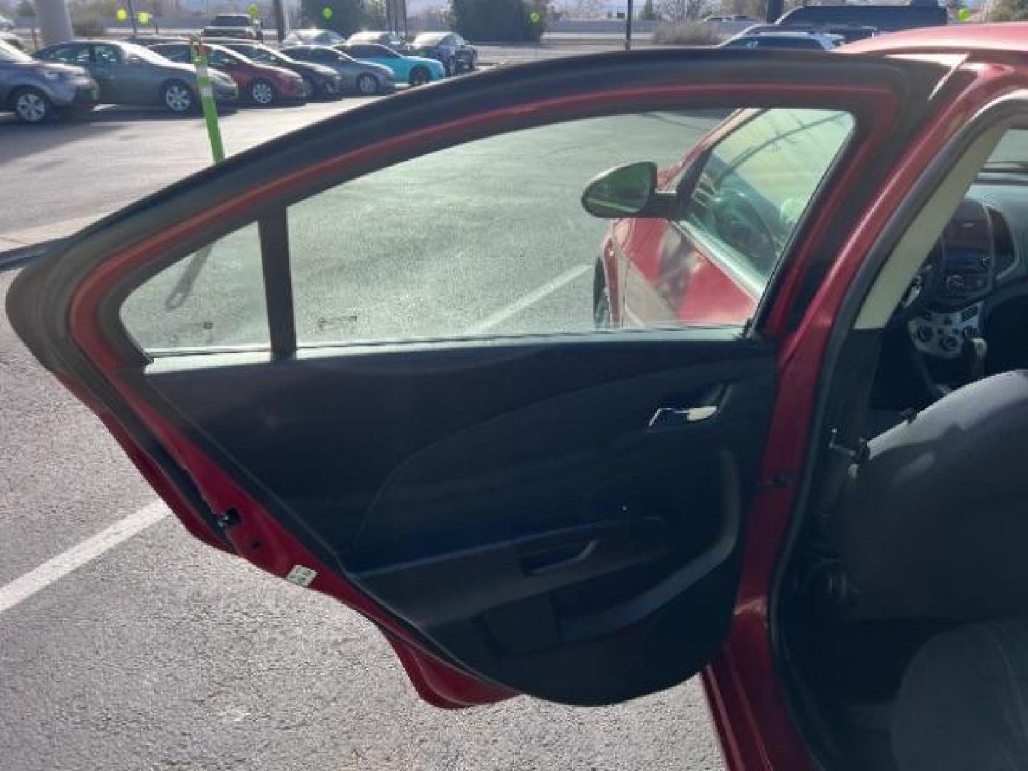 2014 Crystal Red Tintcoat /Jet Black/Brick Chevrolet Sonic LT Auto Sedan (1G1JC5SH5E4) with an 1.8L L4 DOHC 24V engine, 6-Speed Automatic transmission, located at 1865 East Red Hills Pkwy, St. George, 84770, (435) 628-0023, 37.120850, -113.543640 - We specialize in helping ALL people get the best financing available. No matter your credit score, good, bad or none we can get you an amazing rate. Had a bankruptcy, divorce, or repossessions? We give you the green light to get your credit back on the road. Low down and affordable payments that fit - Photo#19