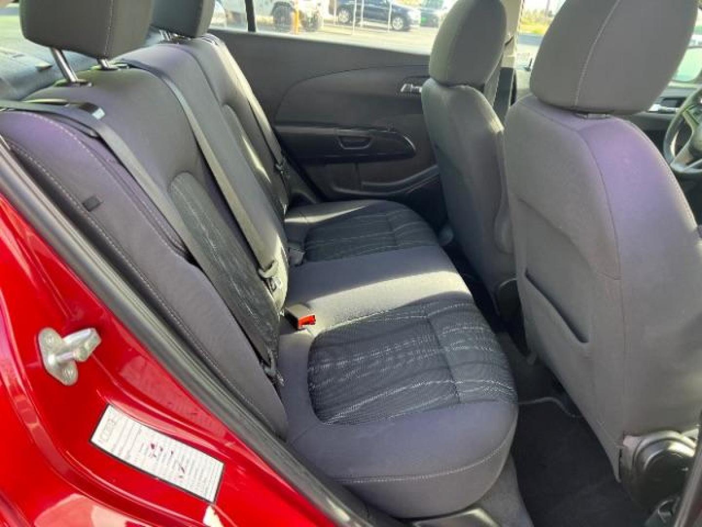 2014 Crystal Red Tintcoat /Jet Black/Brick Chevrolet Sonic LT Auto Sedan (1G1JC5SH5E4) with an 1.8L L4 DOHC 24V engine, 6-Speed Automatic transmission, located at 1865 East Red Hills Pkwy, St. George, 84770, (435) 628-0023, 37.120850, -113.543640 - We specialize in helping ALL people get the best financing available. No matter your credit score, good, bad or none we can get you an amazing rate. Had a bankruptcy, divorce, or repossessions? We give you the green light to get your credit back on the road. Low down and affordable payments that fit - Photo#23
