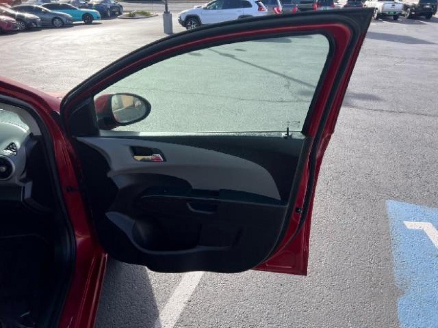 2014 Crystal Red Tintcoat /Jet Black/Brick Chevrolet Sonic LT Auto Sedan (1G1JC5SH5E4) with an 1.8L L4 DOHC 24V engine, 6-Speed Automatic transmission, located at 1865 East Red Hills Pkwy, St. George, 84770, (435) 628-0023, 37.120850, -113.543640 - We specialize in helping ALL people get the best financing available. No matter your credit score, good, bad or none we can get you an amazing rate. Had a bankruptcy, divorce, or repossessions? We give you the green light to get your credit back on the road. Low down and affordable payments that fit - Photo#25