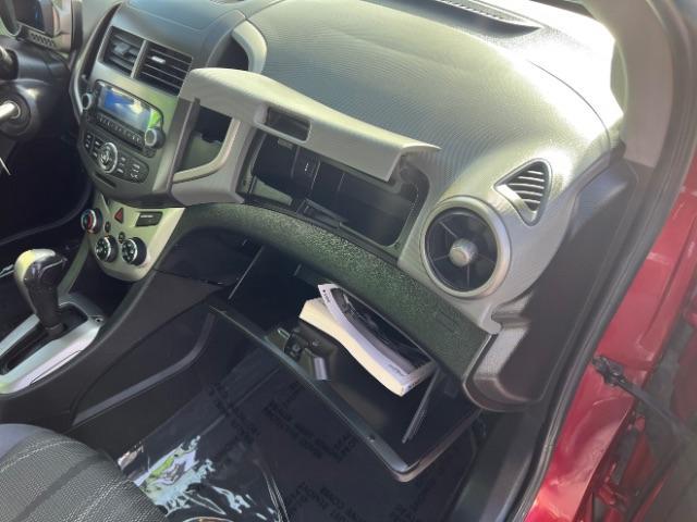 2014 Crystal Red Tintcoat /Jet Black/Brick Chevrolet Sonic LT Auto Sedan (1G1JC5SH5E4) with an 1.8L L4 DOHC 24V engine, 6-Speed Automatic transmission, located at 940 North Main Street, Cedar City, UT, 84720, (435) 628-0023, 37.692936, -113.061897 - We specialize in helping ALL people get the best financing available. No matter your credit score, good, bad or none we can get you an amazing rate. Had a bankruptcy, divorce, or repossessions? We give you the green light to get your credit back on the road. Low down and affordable payments that fit - Photo#27