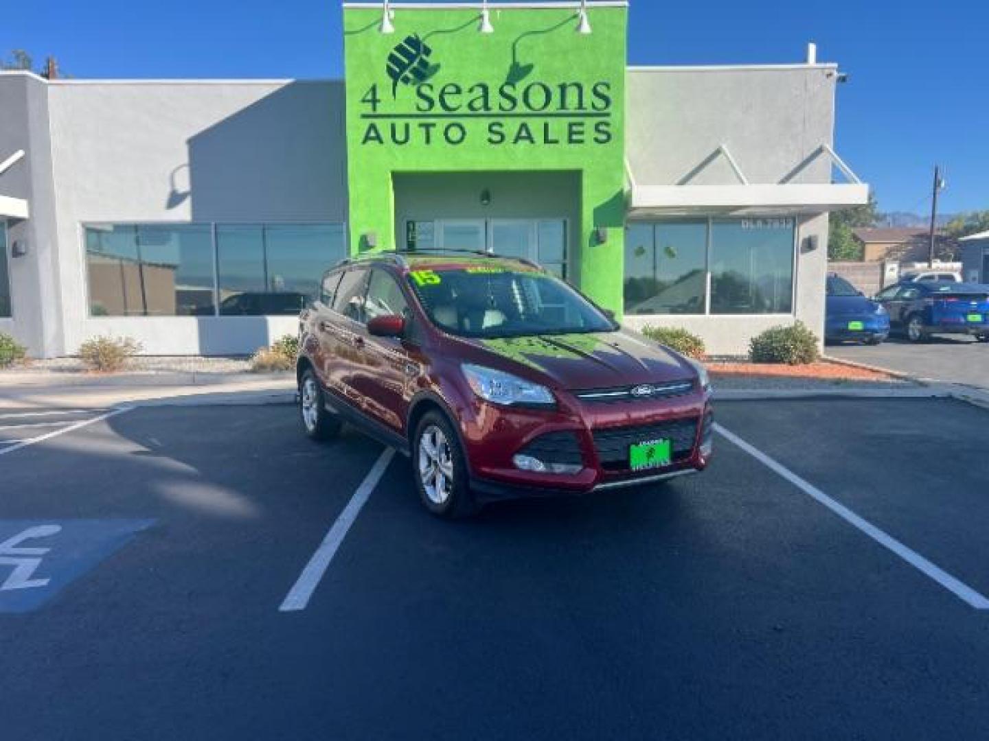 2015 Ruby Red Met Tinted CC /Charcoal Black Ford Escape SE FWD (1FMCU0G79FU) with an 2.5L L4 DOHC 16V engine, 6-Speed Automatic transmission, located at 940 North Main Street, Cedar City, UT, 84720, (435) 628-0023, 37.692936, -113.061897 - Photo#0