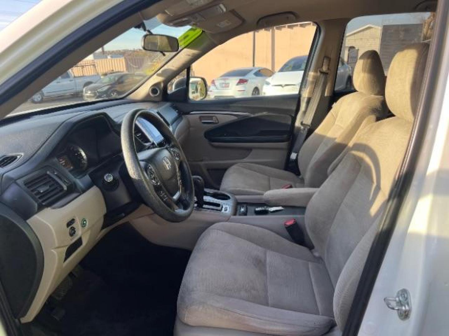 2016 White Diamond Pearl /Gray, cloth Honda Pilot EX 2WD (5FNYF5H35GB) with an 3.5L V6 SOHC 24V engine, 6-Speed Automatic transmission, located at 1865 East Red Hills Pkwy, St. George, 84770, (435) 628-0023, 37.120850, -113.543640 - We specialize in helping ALL people get the best financing available. No matter your credit score, good, bad or none we can get you an amazing rate. Had a bankruptcy, divorce, or repossessions? We give you the green light to get your credit back on the road. Low down and affordable payments that fit - Photo#16