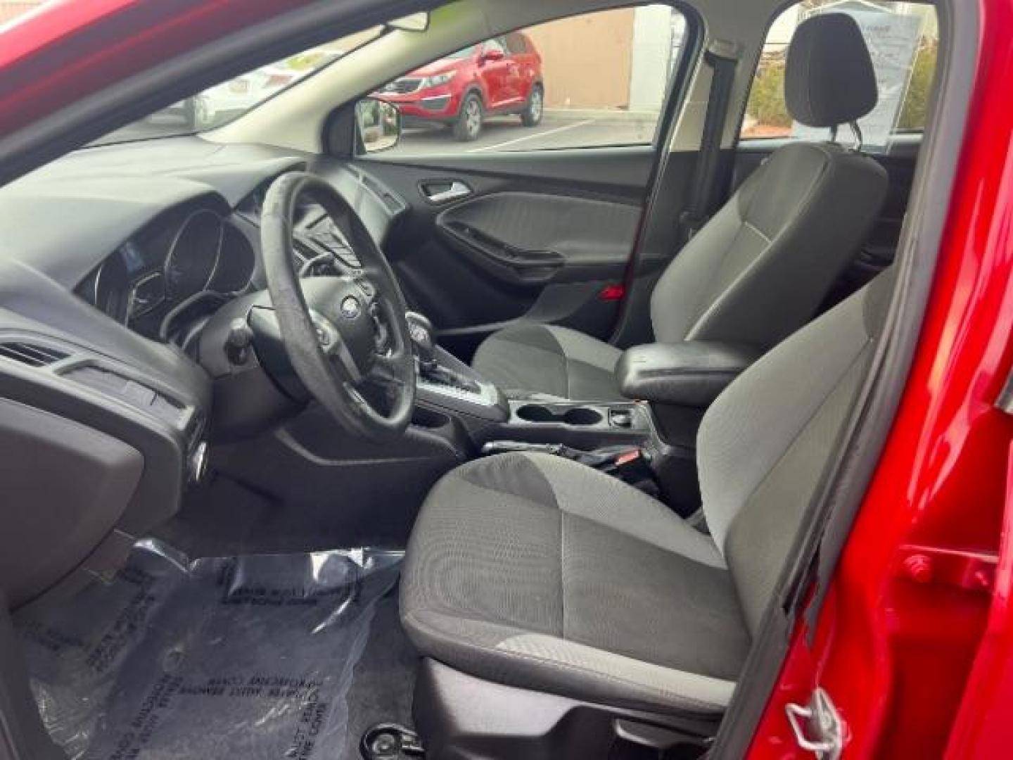 2012 Race Red /Charcoal Black/Metal Gray Cloth Interior Ford Focus SE (1FAHP3K22CL) with an 2.0L L4 DOHC 16V engine, located at 1865 East Red Hills Pkwy, St. George, 84770, (435) 628-0023, 37.120850, -113.543640 - We specialize in helping ALL people get the best financing available. No matter your credit score, good, bad or none we can get you an amazing rate. Had a bankruptcy, divorce, or repossessions? We give you the green light to get your credit back on the road. Low down and affordable payments that fit - Photo#14