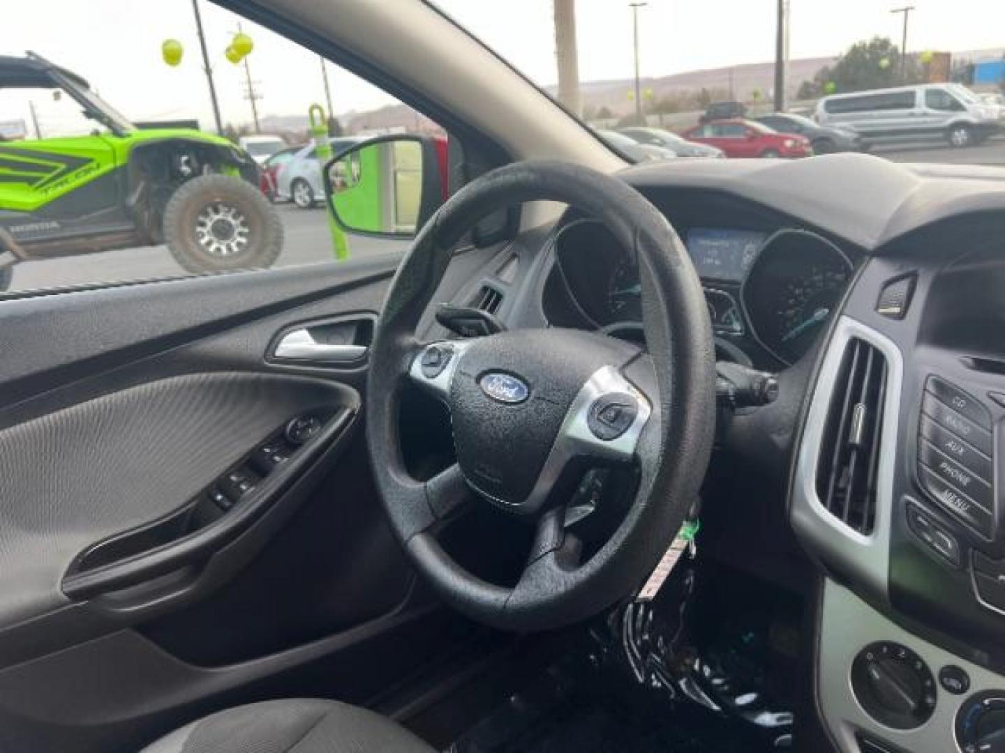 2012 Race Red /Charcoal Black/Metal Gray Cloth Interior Ford Focus SE (1FAHP3K22CL) with an 2.0L L4 DOHC 16V engine, located at 1865 East Red Hills Pkwy, St. George, 84770, (435) 628-0023, 37.120850, -113.543640 - We specialize in helping ALL people get the best financing available. No matter your credit score, good, bad or none we can get you an amazing rate. Had a bankruptcy, divorce, or repossessions? We give you the green light to get your credit back on the road. Low down and affordable payments that fit - Photo#31