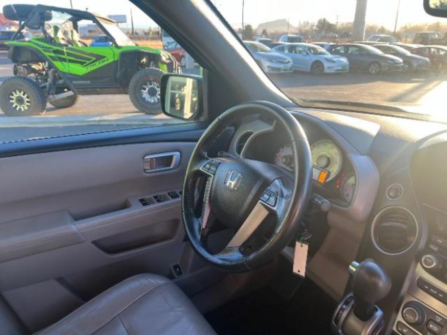 2013 Crystal Black Pearl /Beige Leather Interior Honda Pilot EX-L 4WD 5-Spd AT with Navigation (5FNYF4H79DB) with an 3.5L V6 SOHC 24V engine, 5-Speed Automatic transmission, located at 940 North Main Street, Cedar City, UT, 84720, (435) 628-0023, 37.692936, -113.061897 - We specialize in helping ALL people get the best financing available. No matter your credit score, good, bad or none we can get you an amazing rate. Had a bankruptcy, divorce, or repossessions? We give you the green light to get your credit back on the road. Low down and affordable payments that fit - Photo#33