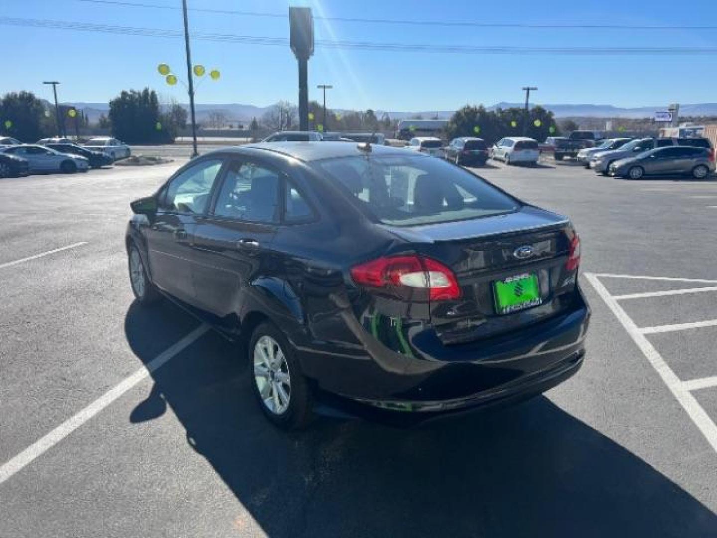 2012 Tuxedo Black Metallic /Charcoal Black/Light Stone Ford Fiesta SE (3FADP4BJ3CM) with an 1.6L I-4 DOHC engine, 5-Speed Manual transmission, located at 1865 East Red Hills Pkwy, St. George, 84770, (435) 628-0023, 37.120850, -113.543640 - Photo#4