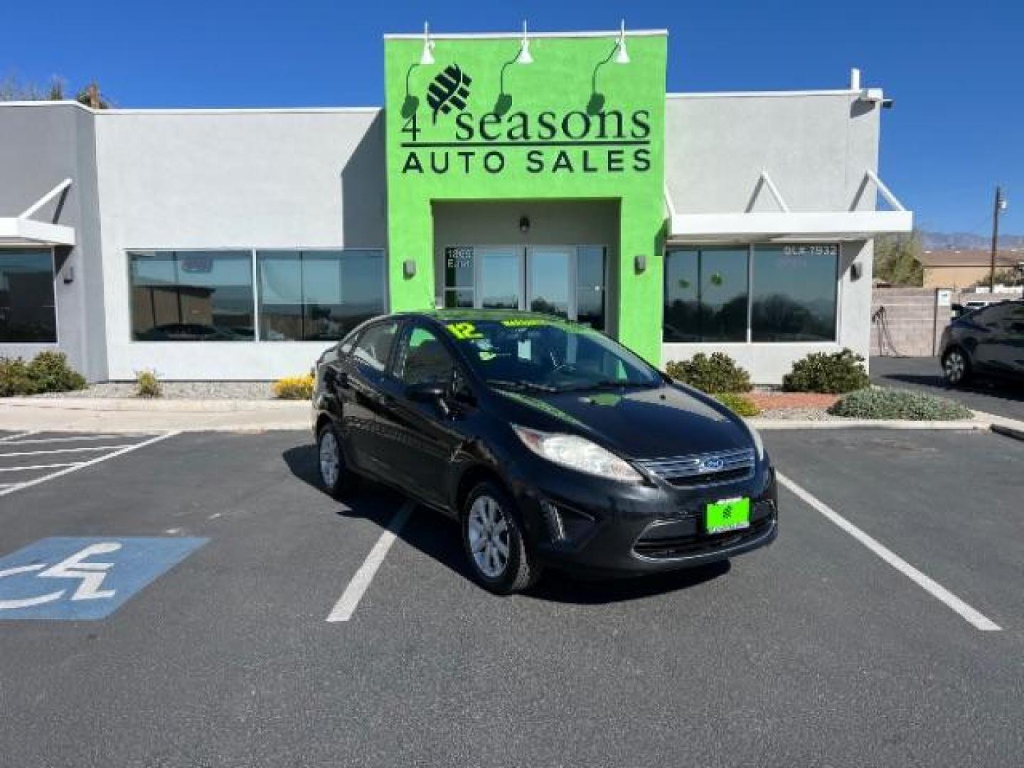 2012 Tuxedo Black Metallic /Charcoal Black/Light Stone Ford Fiesta SE (3FADP4BJ3CM) with an 1.6L I-4 DOHC engine, 5-Speed Manual transmission, located at 1865 East Red Hills Pkwy, St. George, 84770, (435) 628-0023, 37.120850, -113.543640 - Looking for a zippy, fuel-efficient car that is fun to drive and easy on your budget? This 2012 Ford Fiesta SE is just the ticket! Compact, stylish, and surprisingly well-equipped, this Fiesta comes loaded with air conditioning, heated front seats, chrome wheels, full size spare tire, deep tinted gl- Photo#0