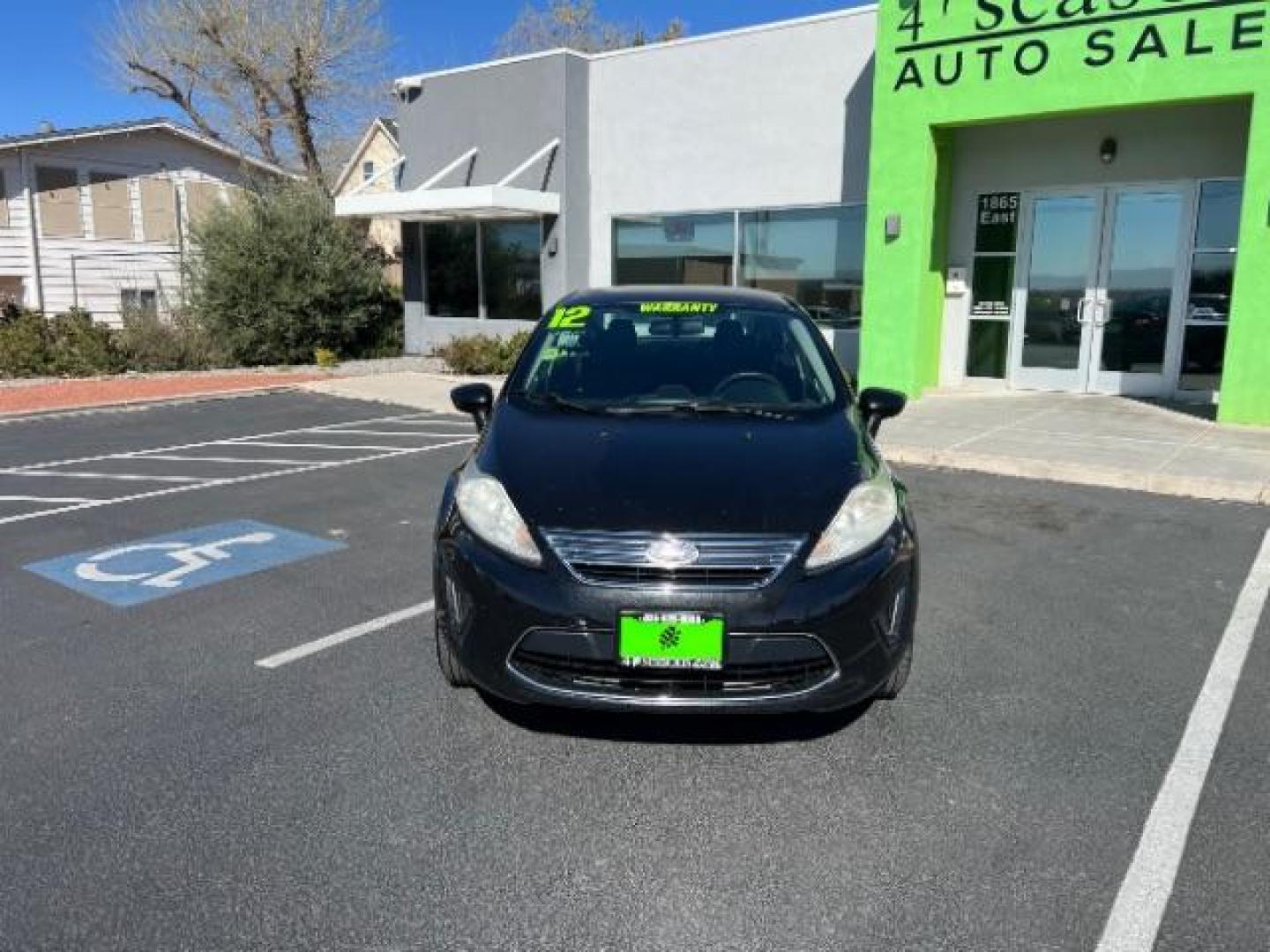 2012 Tuxedo Black Metallic /Charcoal Black/Light Stone Ford Fiesta SE (3FADP4BJ3CM) with an 1.6L I-4 DOHC engine, 5-Speed Manual transmission, located at 1865 East Red Hills Pkwy, St. George, 84770, (435) 628-0023, 37.120850, -113.543640 - Looking for a zippy, fuel-efficient car that is fun to drive and easy on your budget? This 2012 Ford Fiesta SE is just the ticket! Compact, stylish, and surprisingly well-equipped, this Fiesta comes loaded with air conditioning, heated front seats, chrome wheels, full size spare tire, deep tinted gl- Photo#1