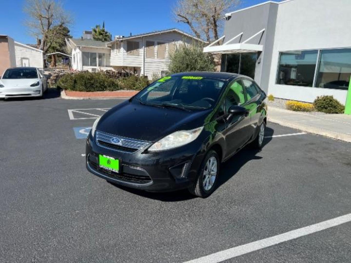 2012 Tuxedo Black Metallic /Charcoal Black/Light Stone Ford Fiesta SE (3FADP4BJ3CM) with an 1.6L I-4 DOHC engine, 5-Speed Manual transmission, located at 1865 East Red Hills Pkwy, St. George, 84770, (435) 628-0023, 37.120850, -113.543640 - Looking for a zippy, fuel-efficient car that is fun to drive and easy on your budget? This 2012 Ford Fiesta SE is just the ticket! Compact, stylish, and surprisingly well-equipped, this Fiesta comes loaded with air conditioning, heated front seats, chrome wheels, full size spare tire, deep tinted gl- Photo#2