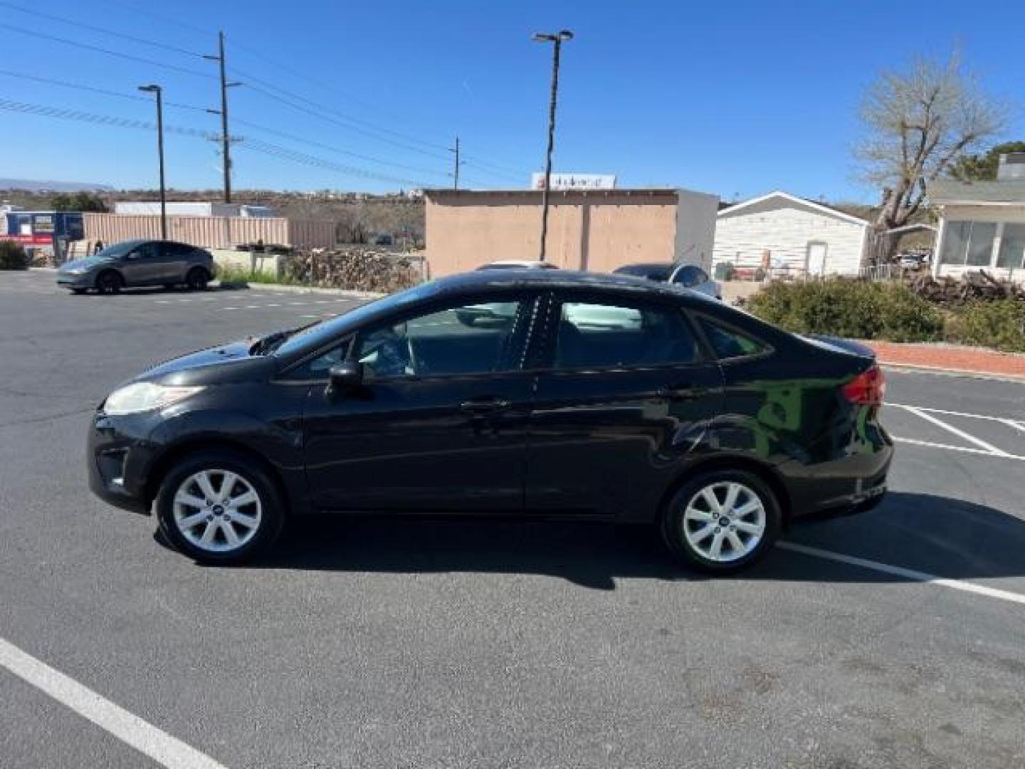 2012 Tuxedo Black Metallic /Charcoal Black/Light Stone Ford Fiesta SE (3FADP4BJ3CM) with an 1.6L I-4 DOHC engine, 5-Speed Manual transmission, located at 1865 East Red Hills Pkwy, St. George, 84770, (435) 628-0023, 37.120850, -113.543640 - Looking for a zippy, fuel-efficient car that is fun to drive and easy on your budget? This 2012 Ford Fiesta SE is just the ticket! Compact, stylish, and surprisingly well-equipped, this Fiesta comes loaded with air conditioning, heated front seats, chrome wheels, full size spare tire, deep tinted gl- Photo#3