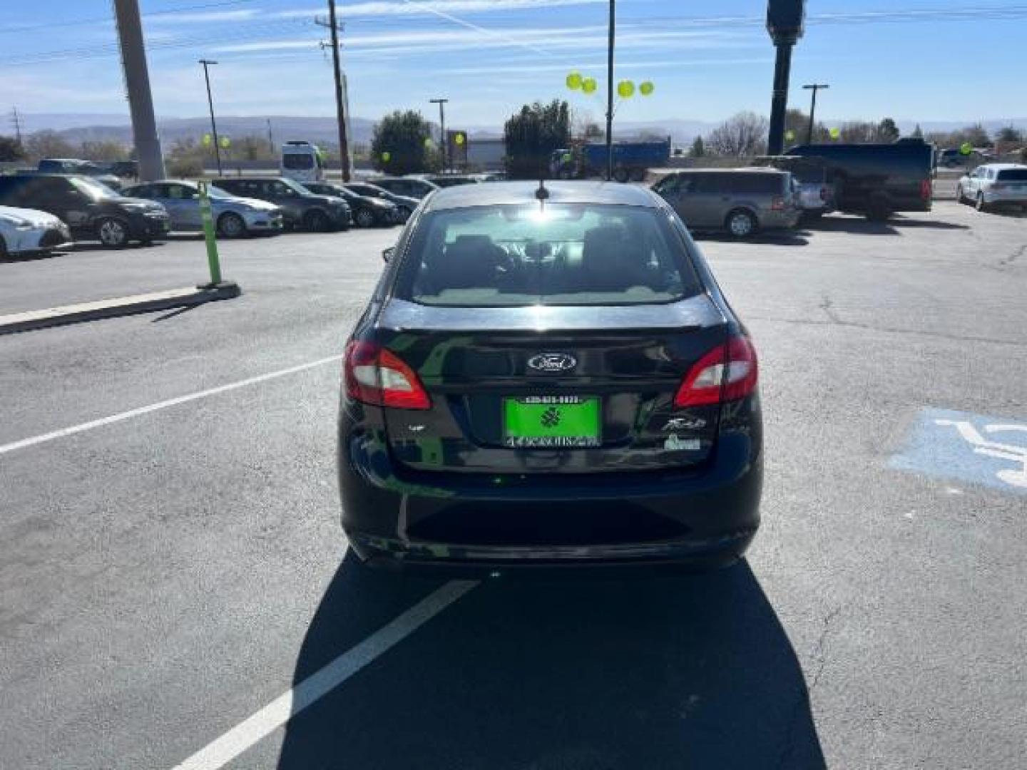 2012 Tuxedo Black Metallic /Charcoal Black/Light Stone Ford Fiesta SE (3FADP4BJ3CM) with an 1.6L I-4 DOHC engine, 5-Speed Manual transmission, located at 1865 East Red Hills Pkwy, St. George, 84770, (435) 628-0023, 37.120850, -113.543640 - Looking for a zippy, fuel-efficient car that is fun to drive and easy on your budget? This 2012 Ford Fiesta SE is just the ticket! Compact, stylish, and surprisingly well-equipped, this Fiesta comes loaded with air conditioning, heated front seats, chrome wheels, full size spare tire, deep tinted gl- Photo#5