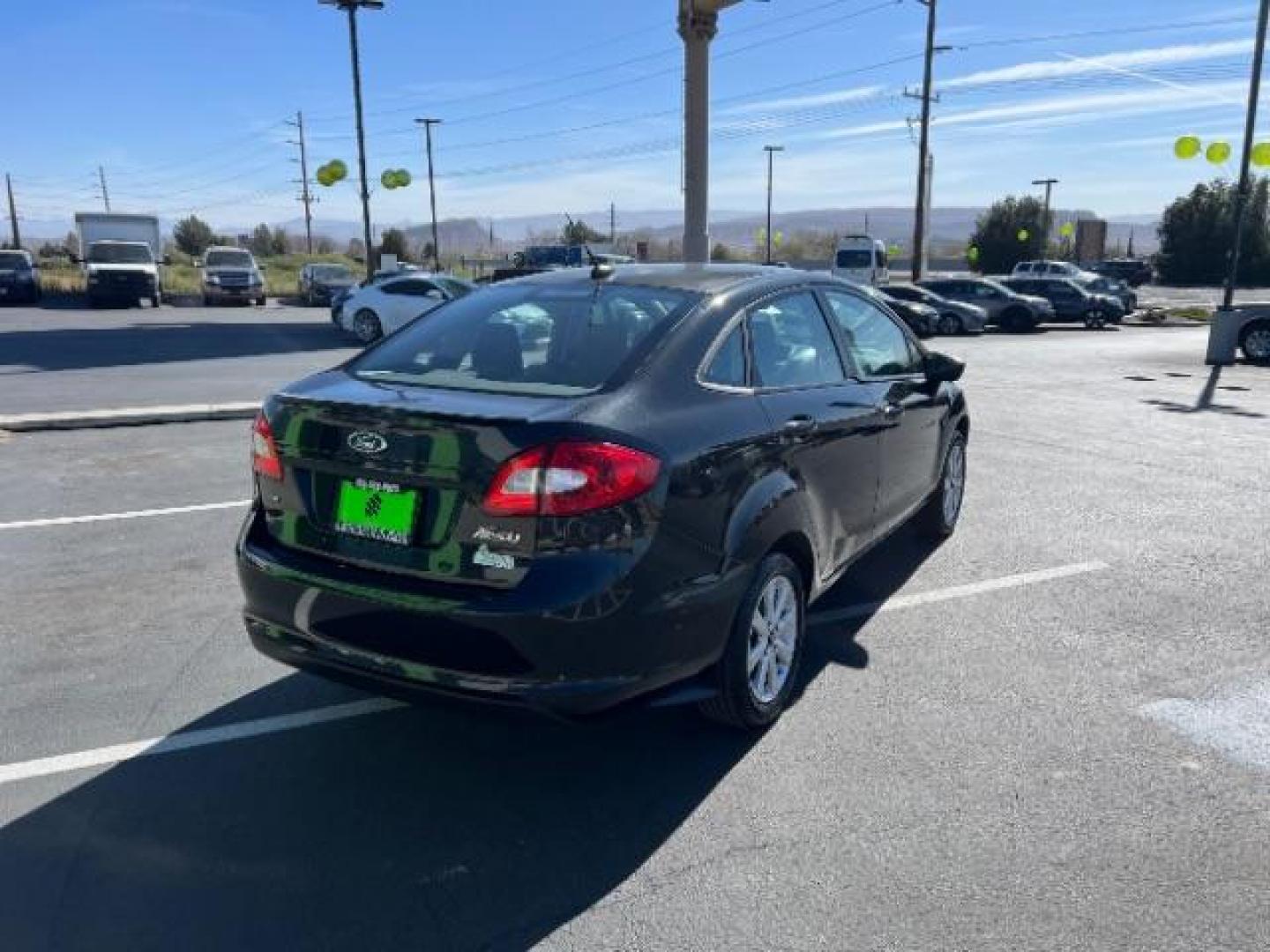 2012 Tuxedo Black Metallic /Charcoal Black/Light Stone Ford Fiesta SE (3FADP4BJ3CM) with an 1.6L I-4 DOHC engine, 5-Speed Manual transmission, located at 1865 East Red Hills Pkwy, St. George, 84770, (435) 628-0023, 37.120850, -113.543640 - Looking for a zippy, fuel-efficient car that is fun to drive and easy on your budget? This 2012 Ford Fiesta SE is just the ticket! Compact, stylish, and surprisingly well-equipped, this Fiesta comes loaded with air conditioning, heated front seats, chrome wheels, full size spare tire, deep tinted gl- Photo#6