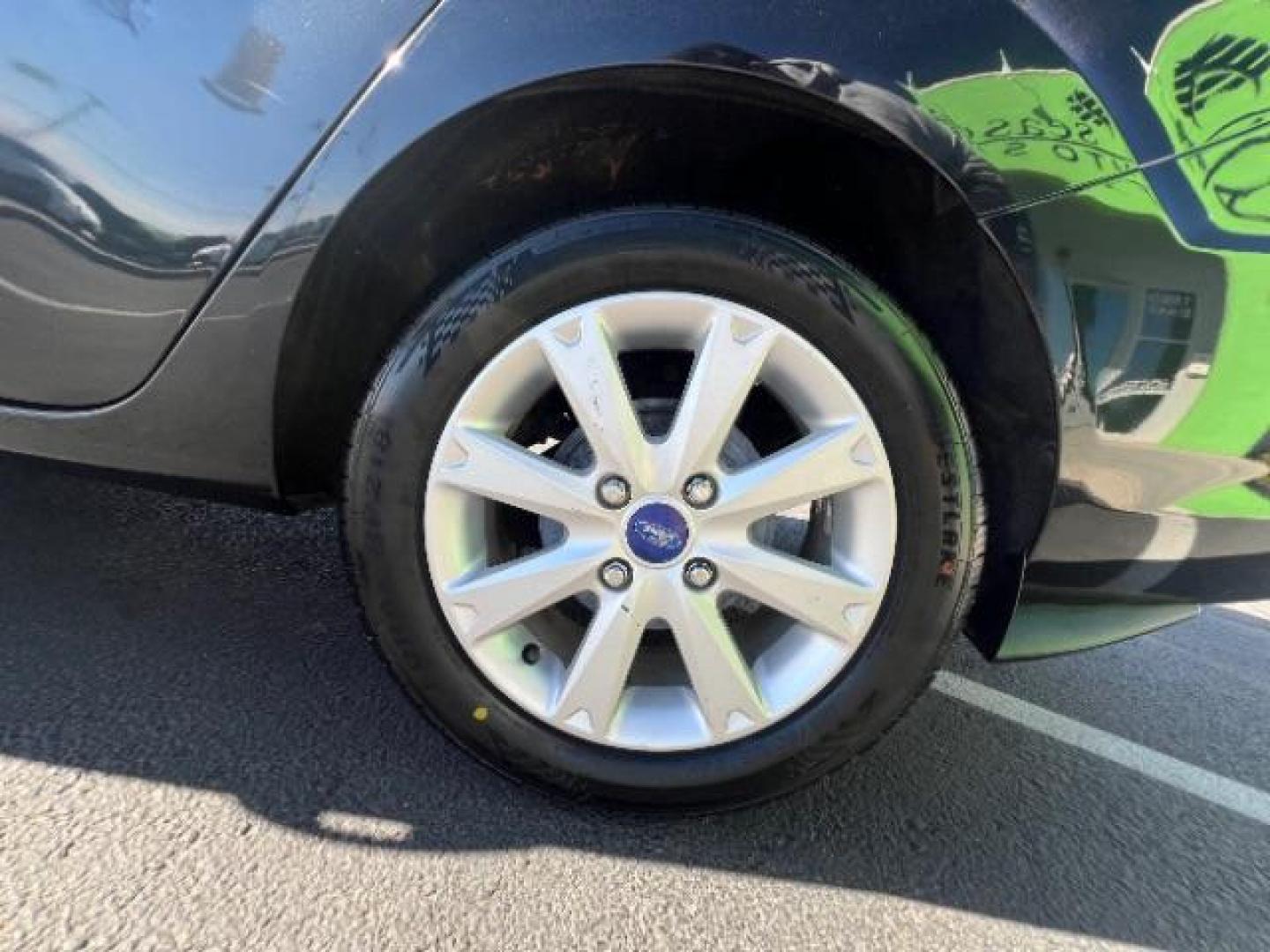 2012 Tuxedo Black Metallic /Charcoal Black/Light Stone Ford Fiesta SE (3FADP4BJ3CM) with an 1.6L I-4 DOHC engine, 5-Speed Manual transmission, located at 1865 East Red Hills Pkwy, St. George, 84770, (435) 628-0023, 37.120850, -113.543640 - Looking for a zippy, fuel-efficient car that is fun to drive and easy on your budget? This 2012 Ford Fiesta SE is just the ticket! Compact, stylish, and surprisingly well-equipped, this Fiesta comes loaded with air conditioning, heated front seats, chrome wheels, full size spare tire, deep tinted gl- Photo#8