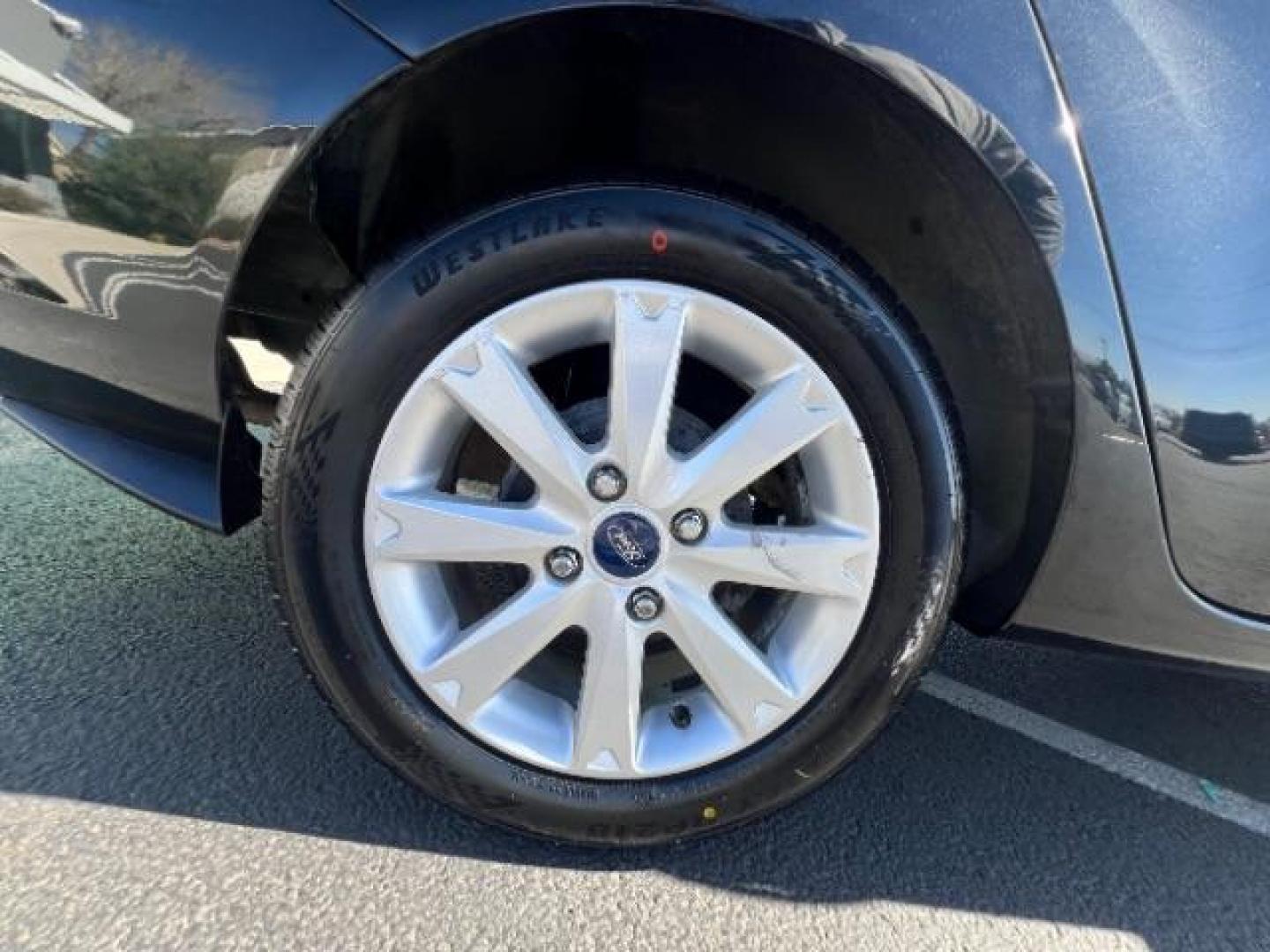 2012 Tuxedo Black Metallic /Charcoal Black/Light Stone Ford Fiesta SE (3FADP4BJ3CM) with an 1.6L I-4 DOHC engine, 5-Speed Manual transmission, located at 1865 East Red Hills Pkwy, St. George, 84770, (435) 628-0023, 37.120850, -113.543640 - Looking for a zippy, fuel-efficient car that is fun to drive and easy on your budget? This 2012 Ford Fiesta SE is just the ticket! Compact, stylish, and surprisingly well-equipped, this Fiesta comes loaded with air conditioning, heated front seats, chrome wheels, full size spare tire, deep tinted gl- Photo#9