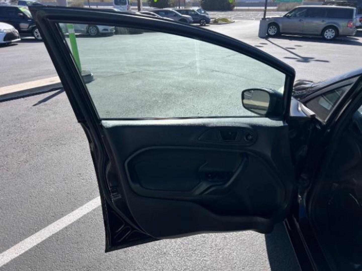 2012 Tuxedo Black Metallic /Charcoal Black/Light Stone Ford Fiesta SE (3FADP4BJ3CM) with an 1.6L I-4 DOHC engine, 5-Speed Manual transmission, located at 1865 East Red Hills Pkwy, St. George, 84770, (435) 628-0023, 37.120850, -113.543640 - Looking for a zippy, fuel-efficient car that is fun to drive and easy on your budget? This 2012 Ford Fiesta SE is just the ticket! Compact, stylish, and surprisingly well-equipped, this Fiesta comes loaded with air conditioning, heated front seats, chrome wheels, full size spare tire, deep tinted gl- Photo#12