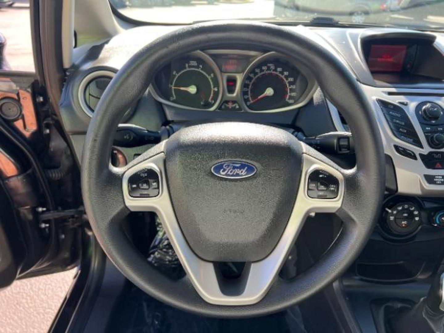 2012 Tuxedo Black Metallic /Charcoal Black/Light Stone Ford Fiesta SE (3FADP4BJ3CM) with an 1.6L I-4 DOHC engine, 5-Speed Manual transmission, located at 1865 East Red Hills Pkwy, St. George, 84770, (435) 628-0023, 37.120850, -113.543640 - Looking for a zippy, fuel-efficient car that is fun to drive and easy on your budget? This 2012 Ford Fiesta SE is just the ticket! Compact, stylish, and surprisingly well-equipped, this Fiesta comes loaded with air conditioning, heated front seats, chrome wheels, full size spare tire, deep tinted gl- Photo#15