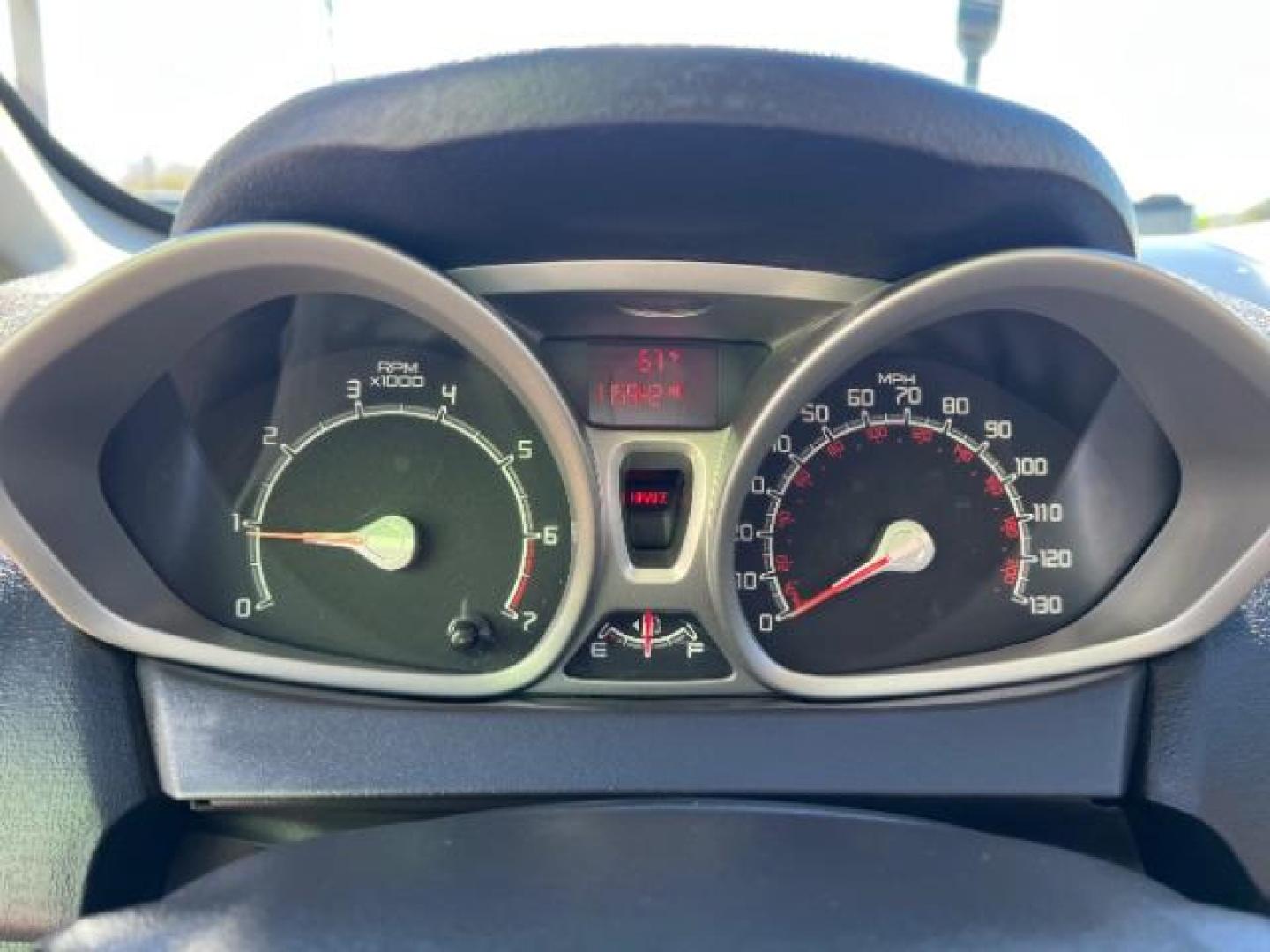2012 Tuxedo Black Metallic /Charcoal Black/Light Stone Ford Fiesta SE (3FADP4BJ3CM) with an 1.6L I-4 DOHC engine, 5-Speed Manual transmission, located at 1865 East Red Hills Pkwy, St. George, 84770, (435) 628-0023, 37.120850, -113.543640 - Looking for a zippy, fuel-efficient car that is fun to drive and easy on your budget? This 2012 Ford Fiesta SE is just the ticket! Compact, stylish, and surprisingly well-equipped, this Fiesta comes loaded with air conditioning, heated front seats, chrome wheels, full size spare tire, deep tinted gl- Photo#16