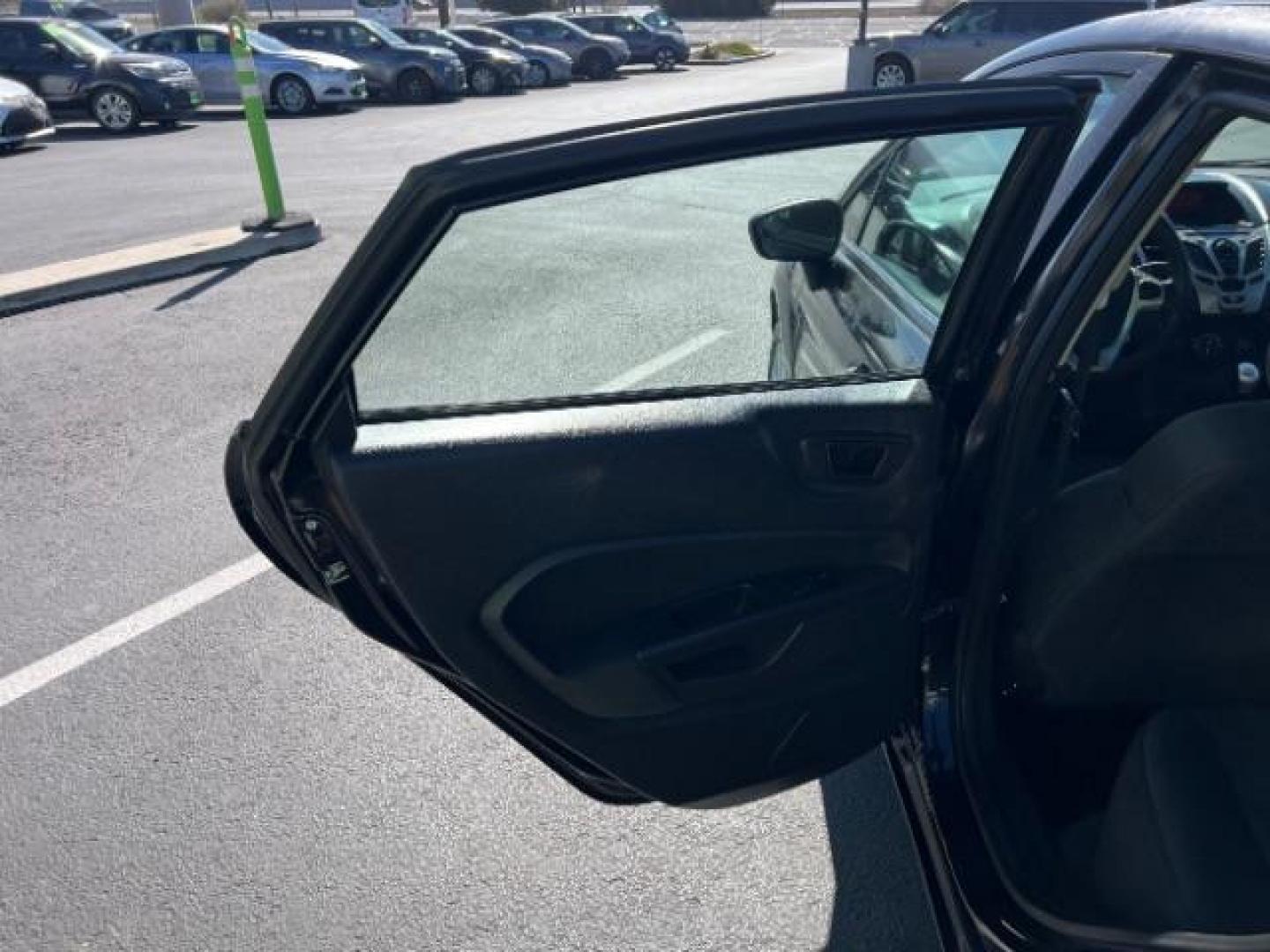 2012 Tuxedo Black Metallic /Charcoal Black/Light Stone Ford Fiesta SE (3FADP4BJ3CM) with an 1.6L I-4 DOHC engine, 5-Speed Manual transmission, located at 1865 East Red Hills Pkwy, St. George, 84770, (435) 628-0023, 37.120850, -113.543640 - Looking for a zippy, fuel-efficient car that is fun to drive and easy on your budget? This 2012 Ford Fiesta SE is just the ticket! Compact, stylish, and surprisingly well-equipped, this Fiesta comes loaded with air conditioning, heated front seats, chrome wheels, full size spare tire, deep tinted gl- Photo#19
