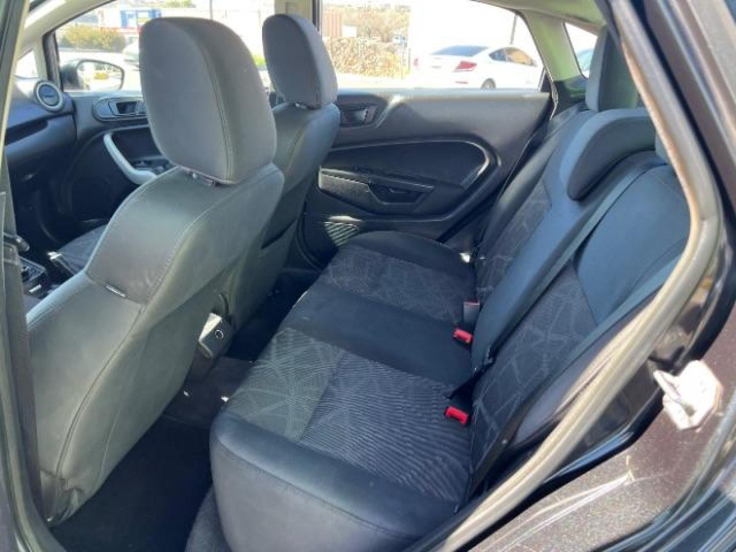 2012 Tuxedo Black Metallic /Charcoal Black/Light Stone Ford Fiesta SE (3FADP4BJ3CM) with an 1.6L I-4 DOHC engine, 5-Speed Manual transmission, located at 1865 East Red Hills Pkwy, St. George, 84770, (435) 628-0023, 37.120850, -113.543640 - Looking for a zippy, fuel-efficient car that is fun to drive and easy on your budget? This 2012 Ford Fiesta SE is just the ticket! Compact, stylish, and surprisingly well-equipped, this Fiesta comes loaded with air conditioning, heated front seats, chrome wheels, full size spare tire, deep tinted gl- Photo#20