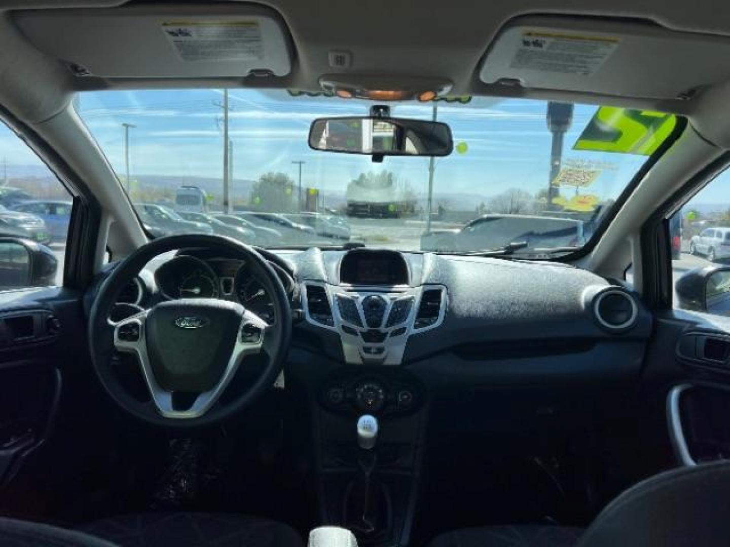 2012 Tuxedo Black Metallic /Charcoal Black/Light Stone Ford Fiesta SE (3FADP4BJ3CM) with an 1.6L I-4 DOHC engine, 5-Speed Manual transmission, located at 1865 East Red Hills Pkwy, St. George, 84770, (435) 628-0023, 37.120850, -113.543640 - Looking for a zippy, fuel-efficient car that is fun to drive and easy on your budget? This 2012 Ford Fiesta SE is just the ticket! Compact, stylish, and surprisingly well-equipped, this Fiesta comes loaded with air conditioning, heated front seats, chrome wheels, full size spare tire, deep tinted gl- Photo#21