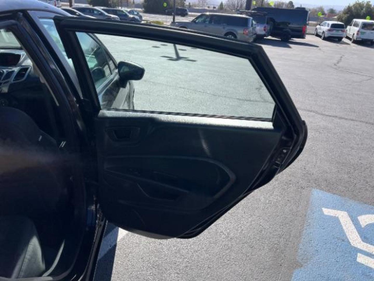 2012 Tuxedo Black Metallic /Charcoal Black/Light Stone Ford Fiesta SE (3FADP4BJ3CM) with an 1.6L I-4 DOHC engine, 5-Speed Manual transmission, located at 1865 East Red Hills Pkwy, St. George, 84770, (435) 628-0023, 37.120850, -113.543640 - Looking for a zippy, fuel-efficient car that is fun to drive and easy on your budget? This 2012 Ford Fiesta SE is just the ticket! Compact, stylish, and surprisingly well-equipped, this Fiesta comes loaded with air conditioning, heated front seats, chrome wheels, full size spare tire, deep tinted gl- Photo#23