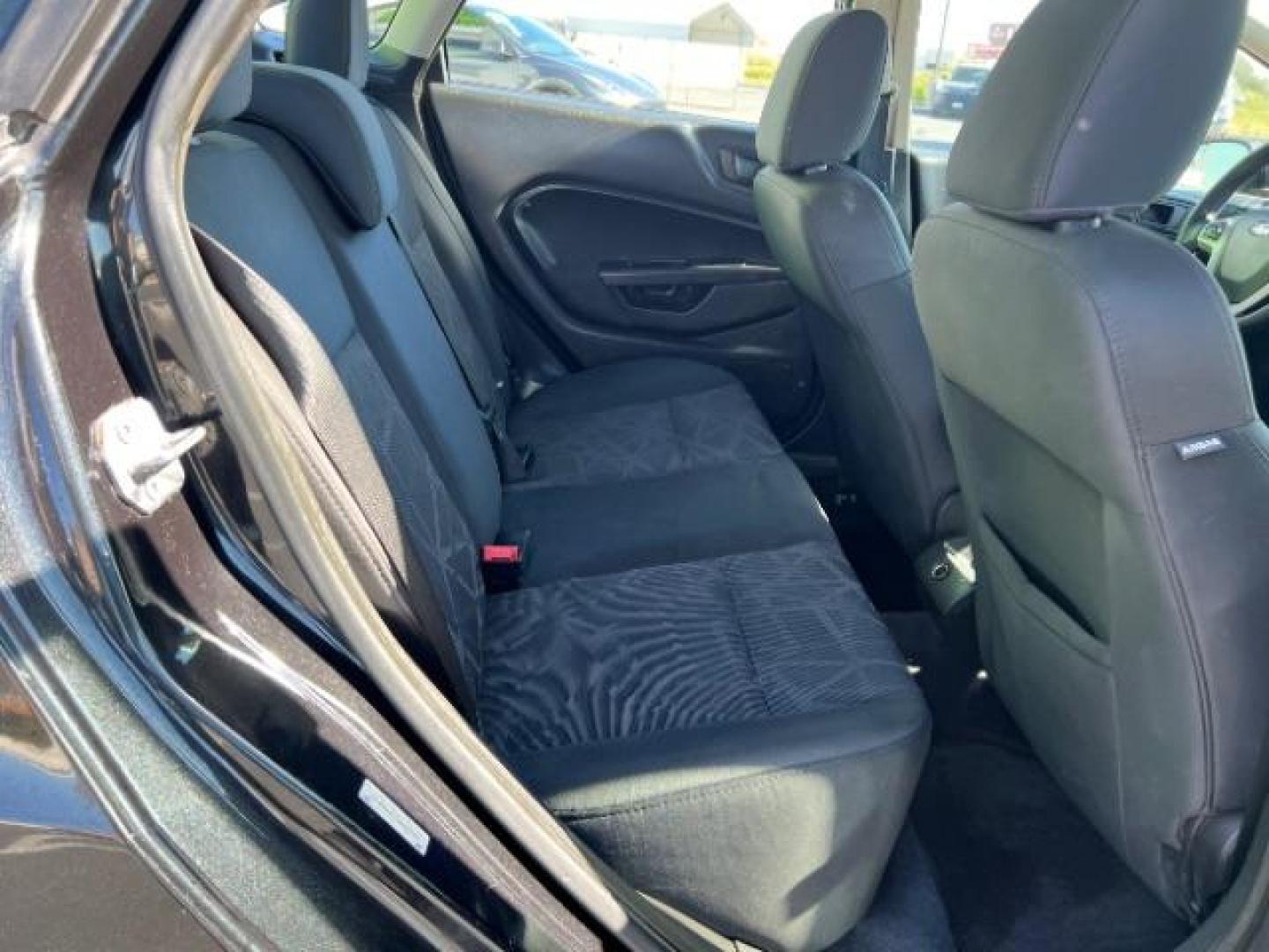 2012 Tuxedo Black Metallic /Charcoal Black/Light Stone Ford Fiesta SE (3FADP4BJ3CM) with an 1.6L I-4 DOHC engine, 5-Speed Manual transmission, located at 1865 East Red Hills Pkwy, St. George, 84770, (435) 628-0023, 37.120850, -113.543640 - Looking for a zippy, fuel-efficient car that is fun to drive and easy on your budget? This 2012 Ford Fiesta SE is just the ticket! Compact, stylish, and surprisingly well-equipped, this Fiesta comes loaded with air conditioning, heated front seats, chrome wheels, full size spare tire, deep tinted gl- Photo#24