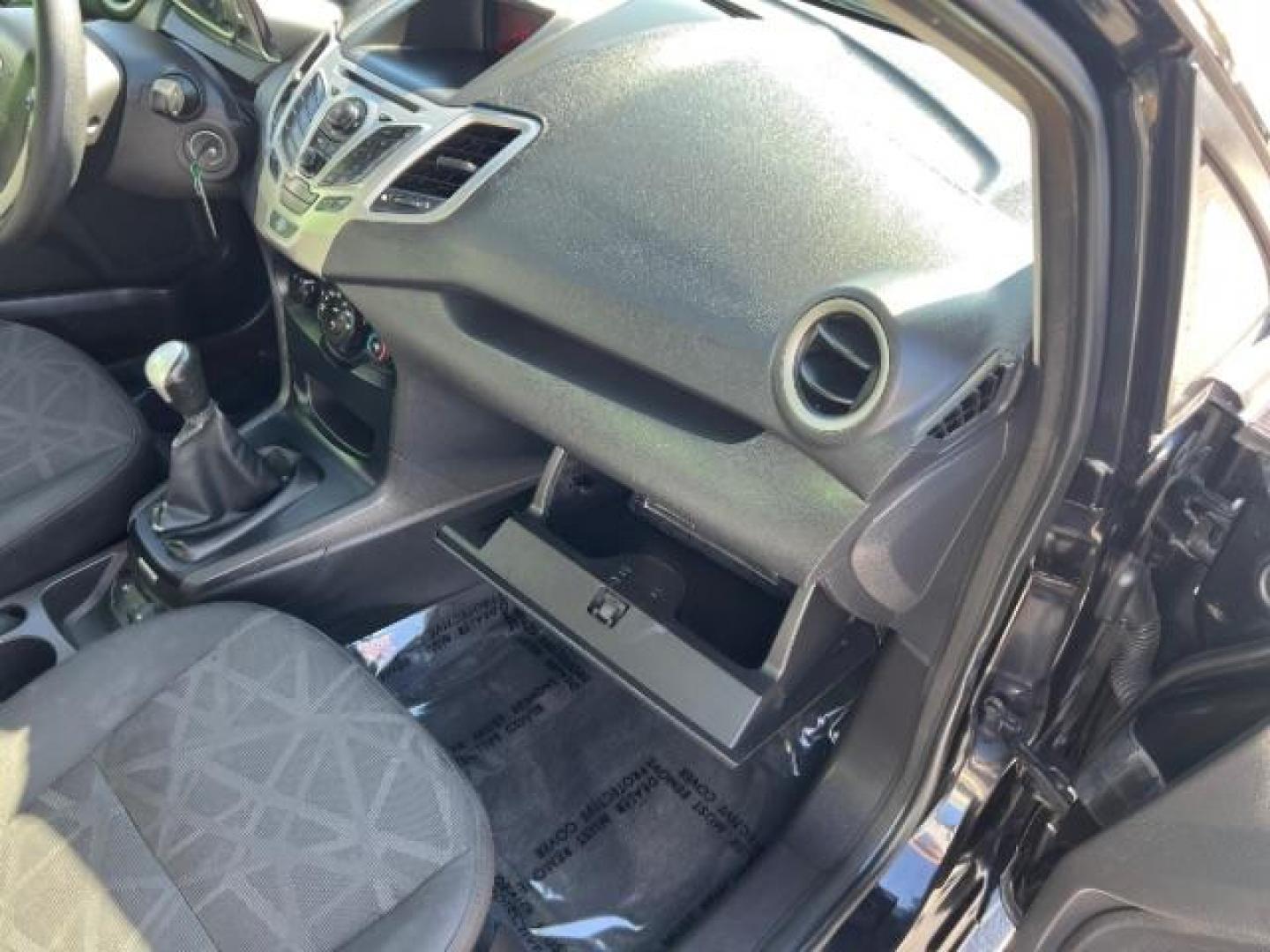 2012 Tuxedo Black Metallic /Charcoal Black/Light Stone Ford Fiesta SE (3FADP4BJ3CM) with an 1.6L I-4 DOHC engine, 5-Speed Manual transmission, located at 1865 East Red Hills Pkwy, St. George, 84770, (435) 628-0023, 37.120850, -113.543640 - Looking for a zippy, fuel-efficient car that is fun to drive and easy on your budget? This 2012 Ford Fiesta SE is just the ticket! Compact, stylish, and surprisingly well-equipped, this Fiesta comes loaded with air conditioning, heated front seats, chrome wheels, full size spare tire, deep tinted gl- Photo#27