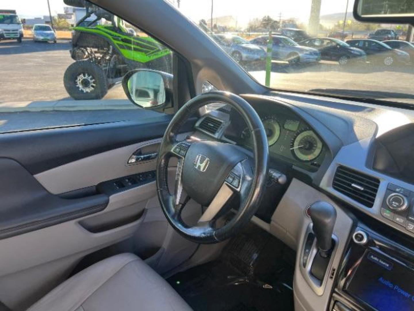 2014 Celestial Blue Metallic /Truffle Honda Odyssey EX-L (5FNRL5H62EB) with an 3.5L V6 SOHC 24V engine, 6-Speed Automatic transmission, located at 940 North Main Street, Cedar City, UT, 84720, (435) 628-0023, 37.692936, -113.061897 - Photo#31