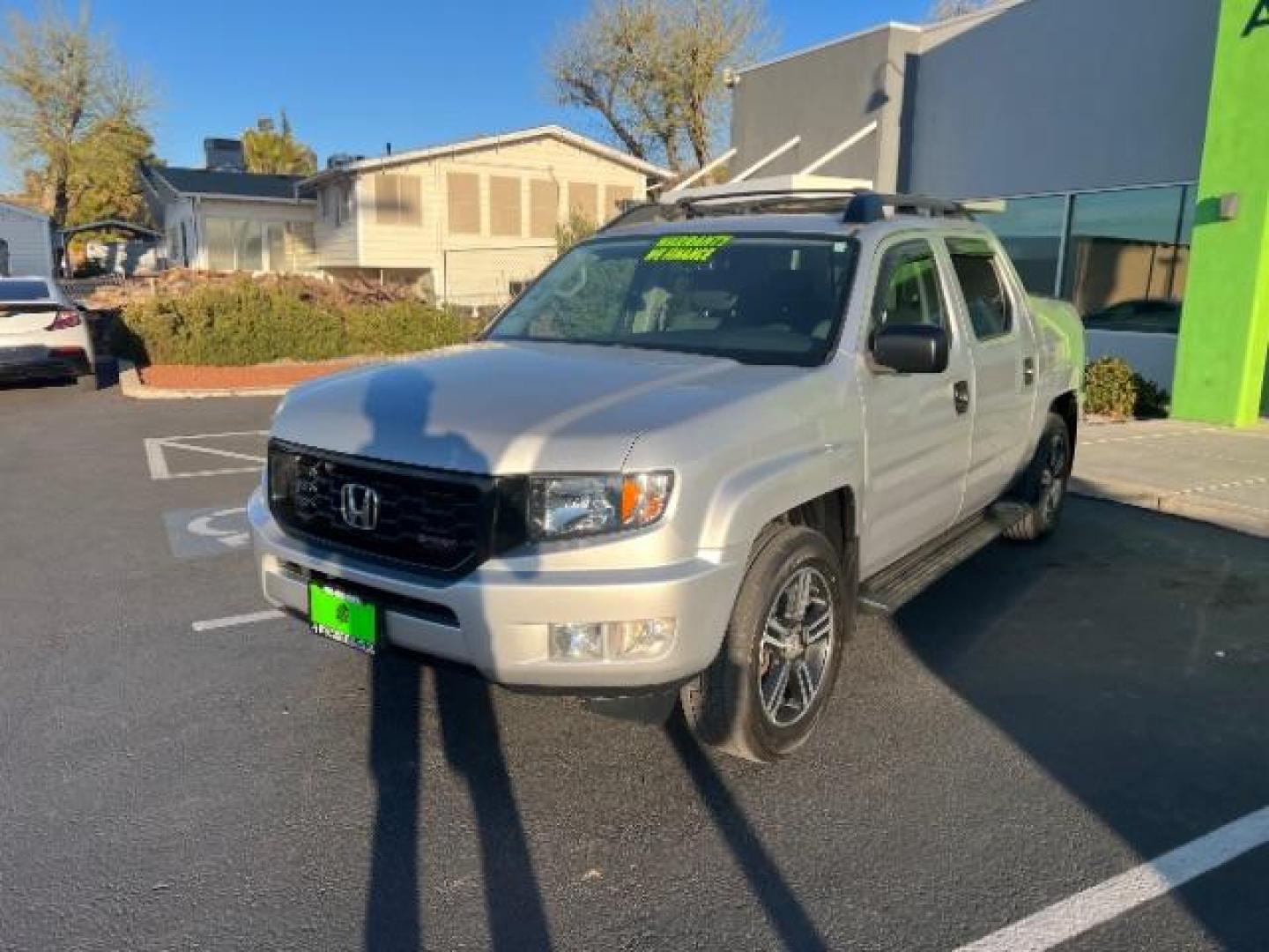 2013 Alabaster Silver Metallic /Black Honda Ridgeline Sport (5FPYK1F75DB) with an 3.5L V-6 variable valve control engine, Continuously Variable Transmission transmission, located at 940 North Main Street, Cedar City, UT, 84720, (435) 628-0023, 37.692936, -113.061897 - We specialize in helping ALL people get the best financing available. No matter your credit score, good, bad or none we can get you an amazing rate. Had a bankruptcy, divorce, or repossessions? We give you the green light to get your credit back on the road. Low down and affordable payments that fit - Photo#2